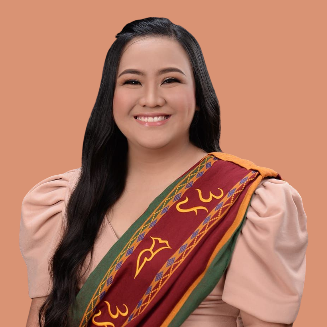 Smiling person wearing traditional graduation attire with a colorful sash on a peach background. startup recruitment lead.