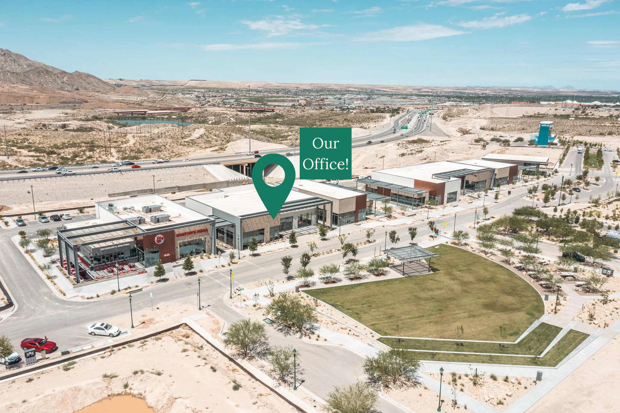 An aerial photograph of the Montecillo shopping center in which Prickly Pear Dental Care is located, with a "pin" image noting the exact location of our dental office.