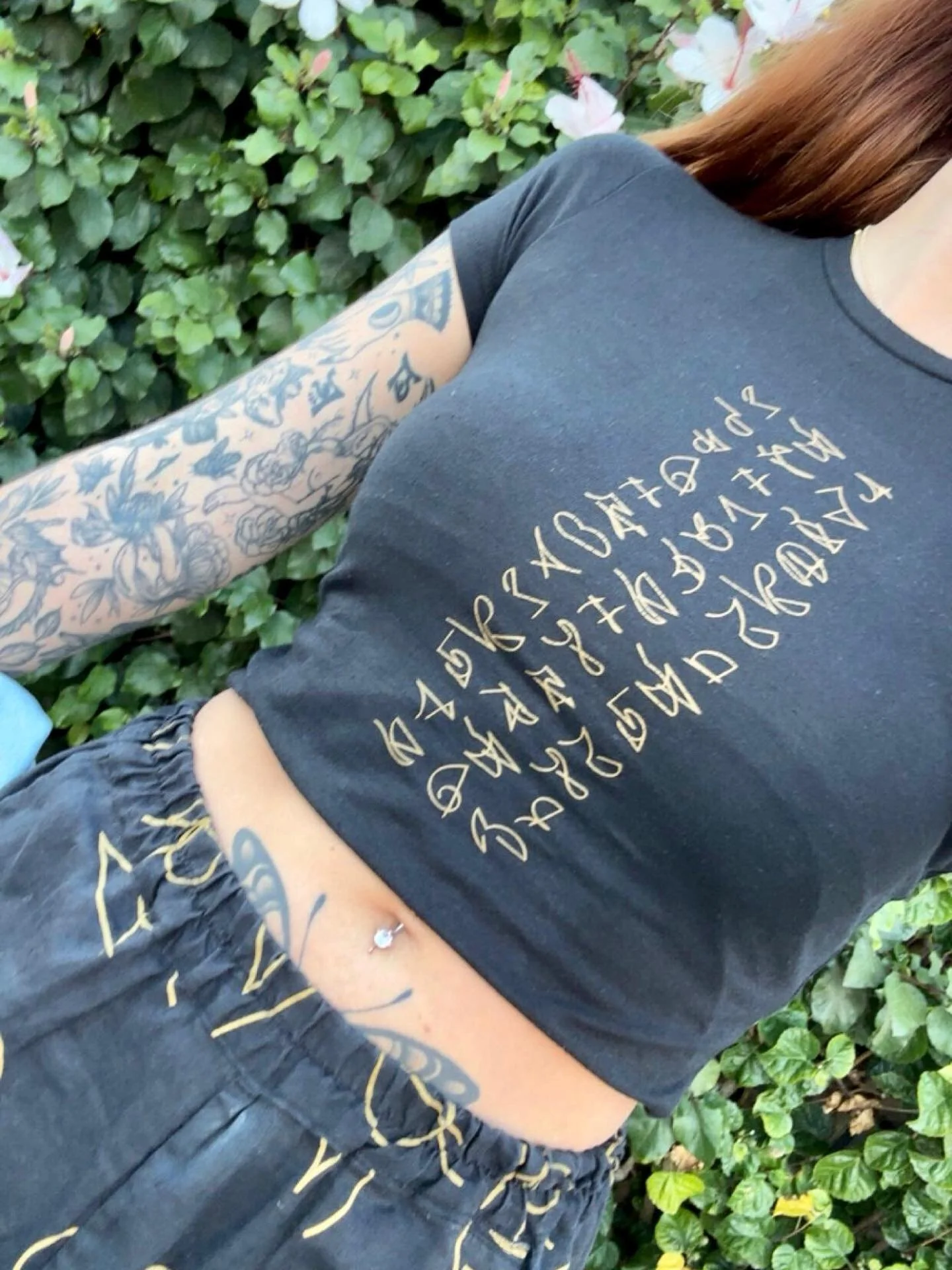 🖤 Why Black? (I thought the colour black isn&rsquo;t high vibe) 
Because it holds the frequency of the clearer &mdash; absorbing and transmuting, offering protection while you walk your path.

✨ Hemp &amp; organic cotton Light Language fitted Tee
✨ 