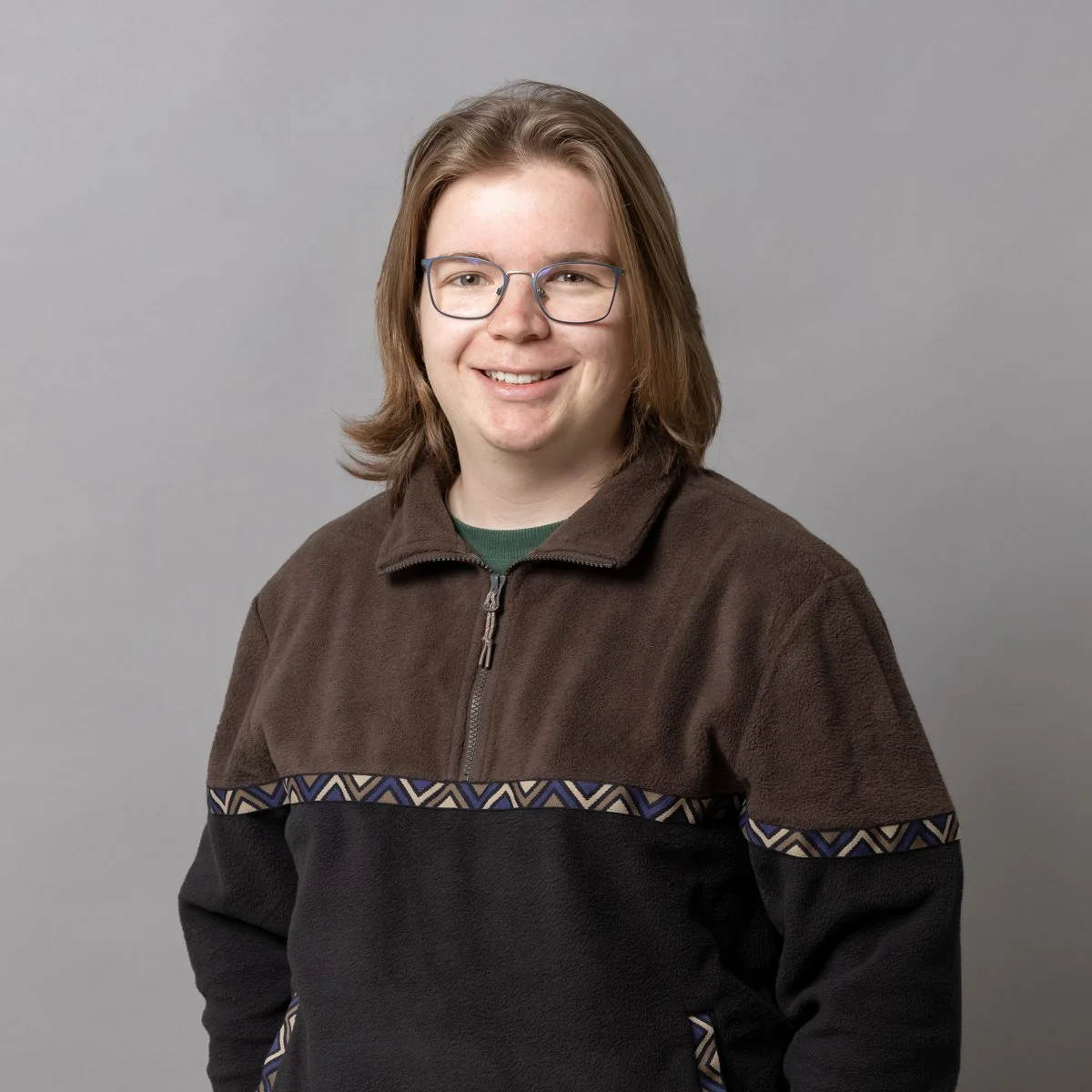 Ein Lächelndes Gesicht in einer einfachen, stilisierten Illustration.