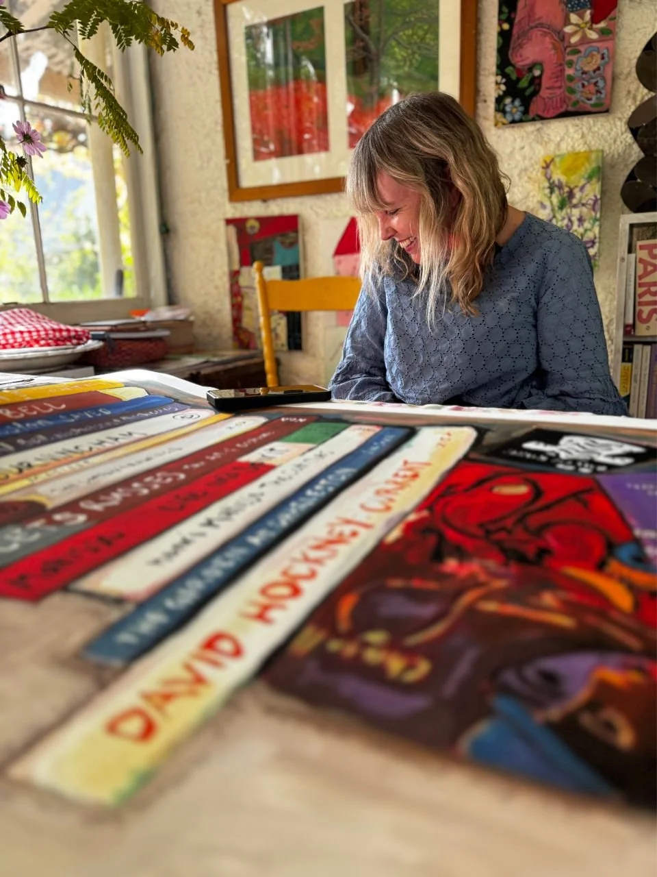 Sara Phemister with Words and Pictures in her home.