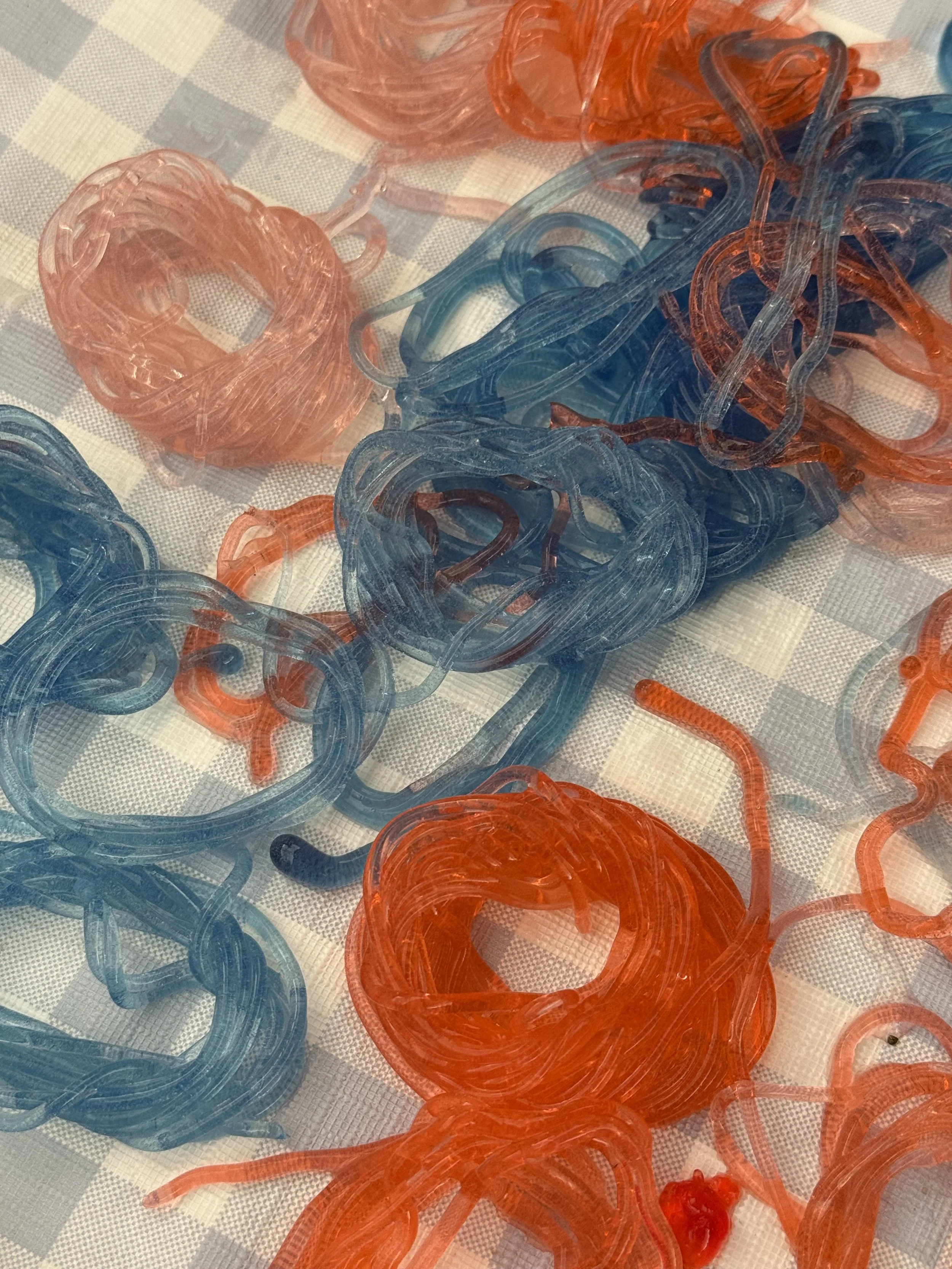 Colourful handmade bioyarns developed from sustainable biomaterials, displayed during a Peel Studio material experimentation workshop.