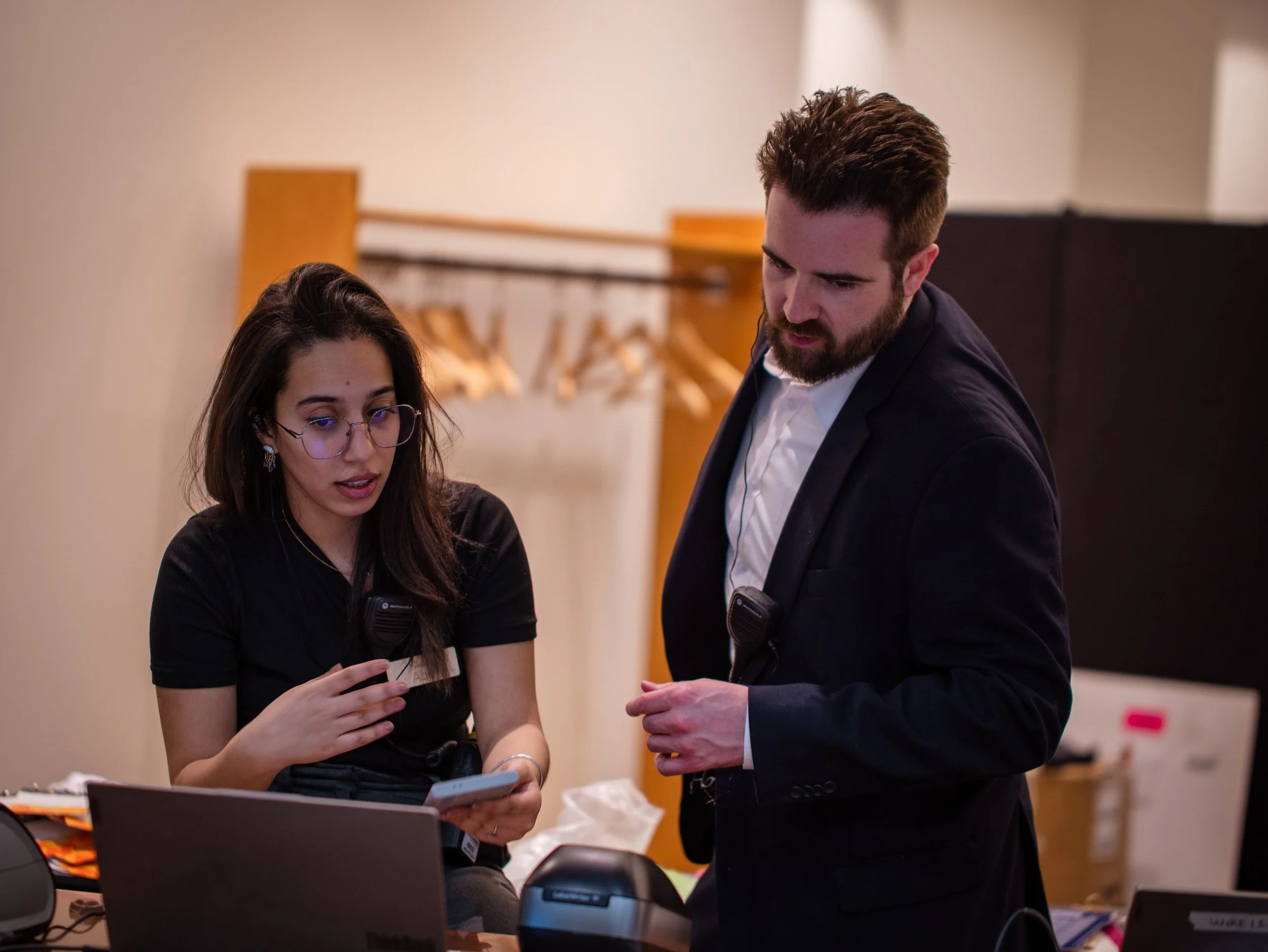 two people looking at computer screen concerned