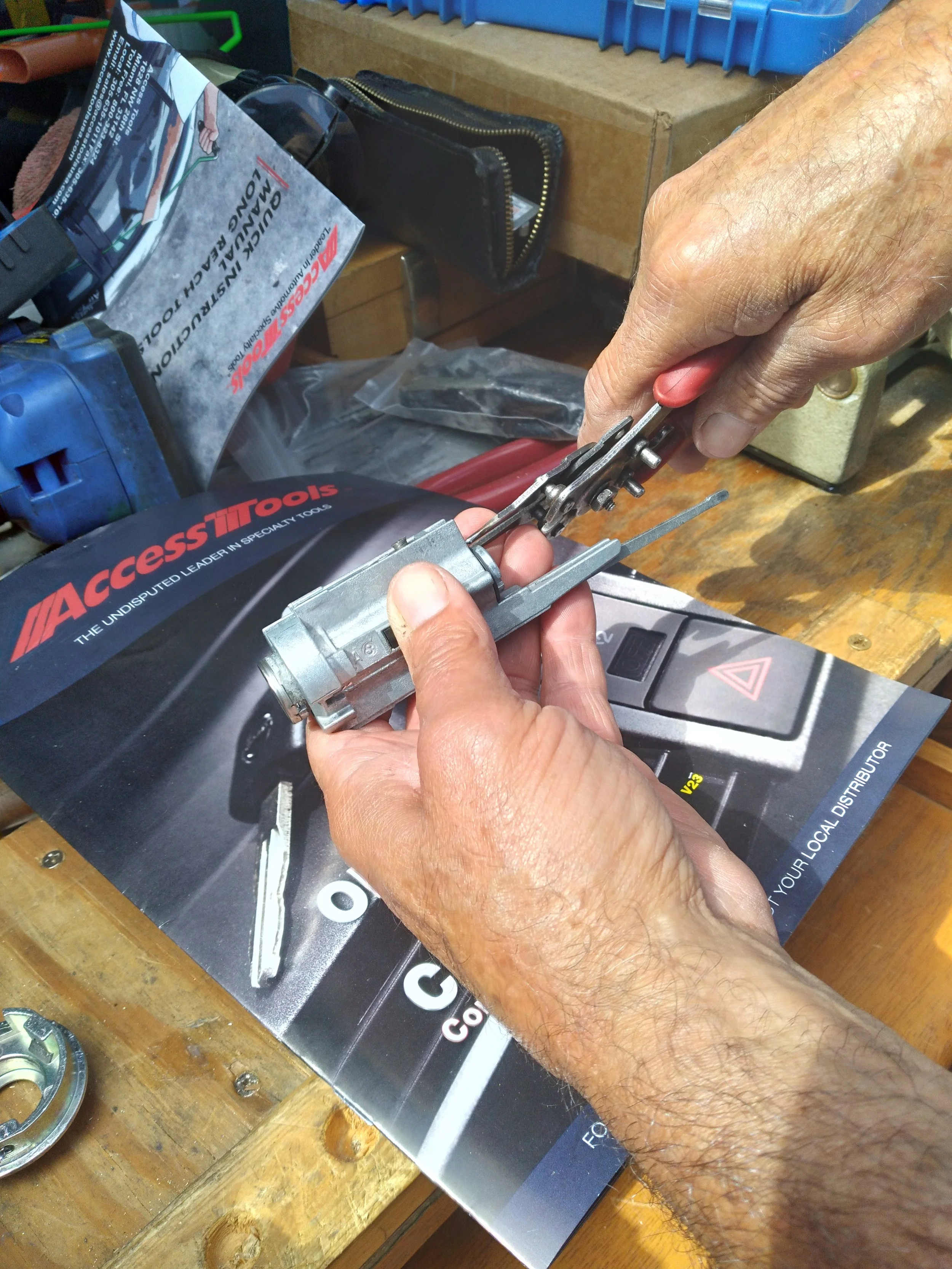 Automotive Ignition Repair – An ignition cylinder being carefully disassembled and serviced to restore proper key operation.