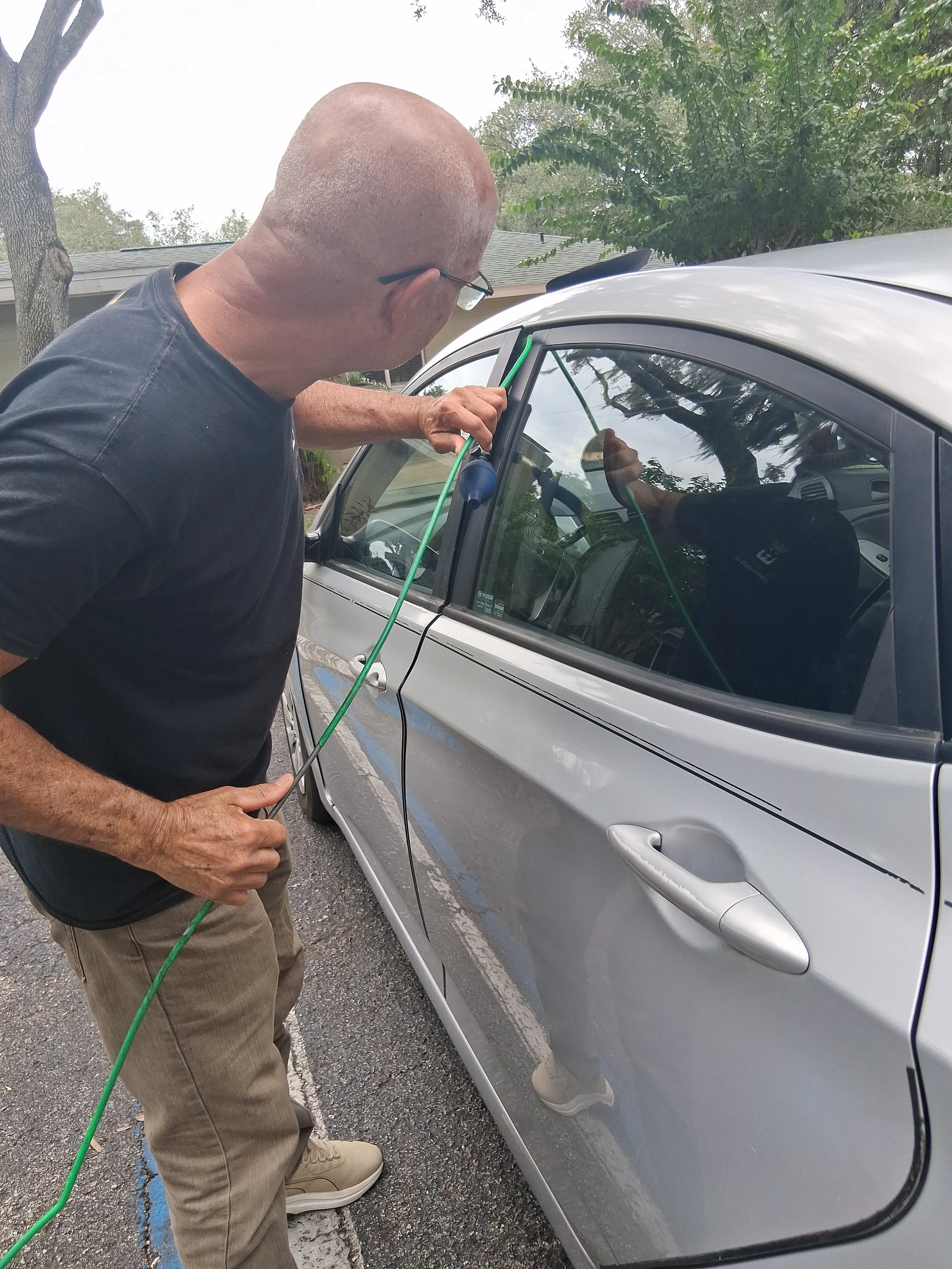 Vehicle Lockout Service – Carefully unlocking a customer’s vehicle using professional locksmith tools.