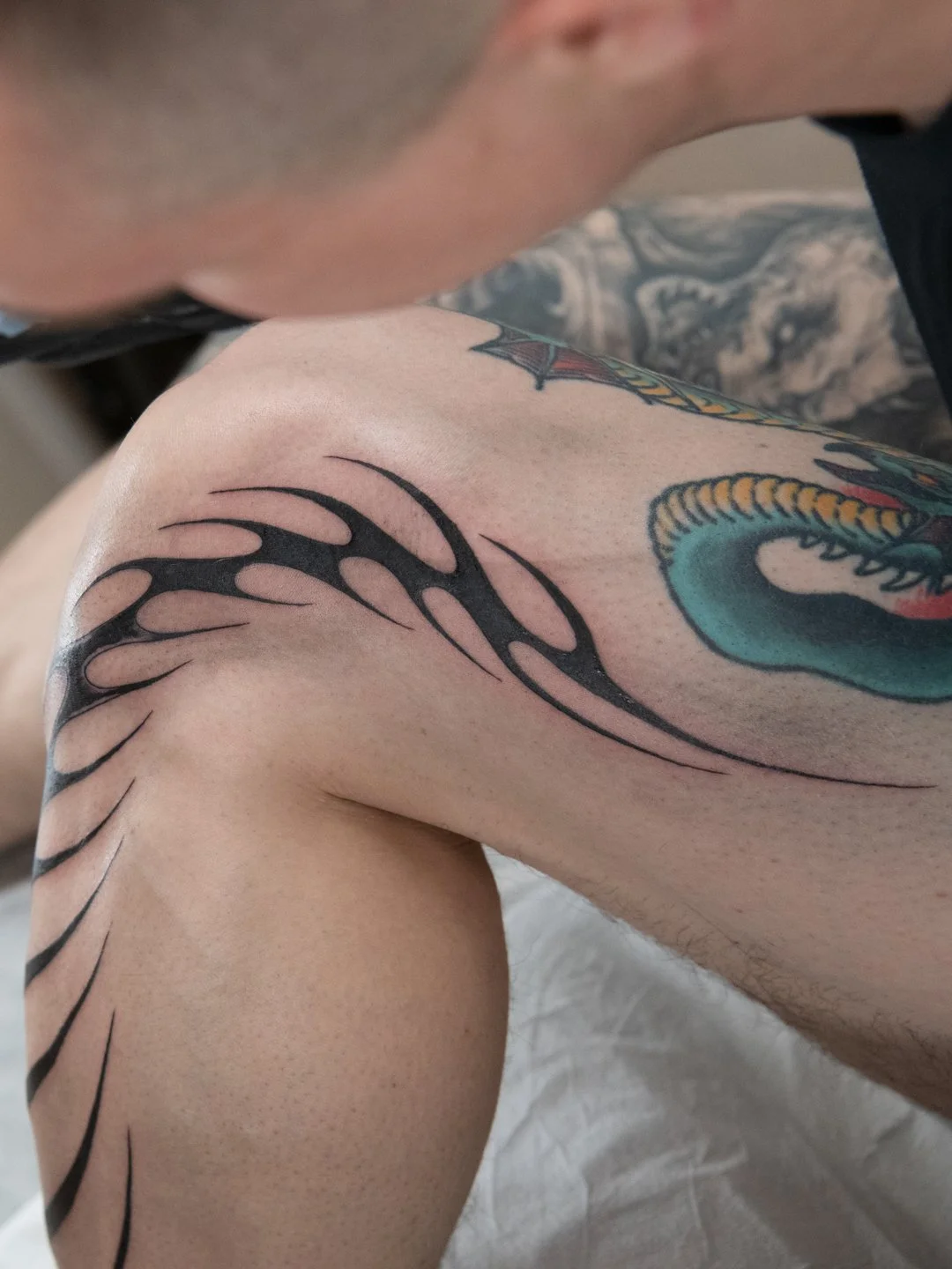 Photo of a blackwork leg tattoo