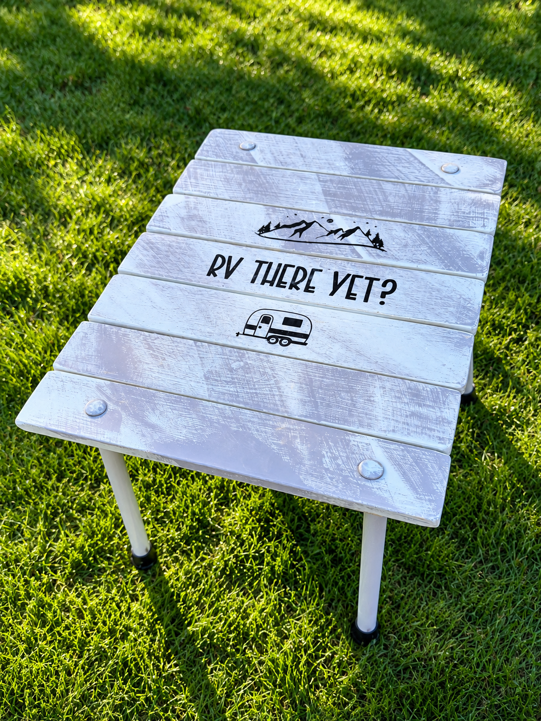 Weathered RV Table on Sunlit Grassno holes.png