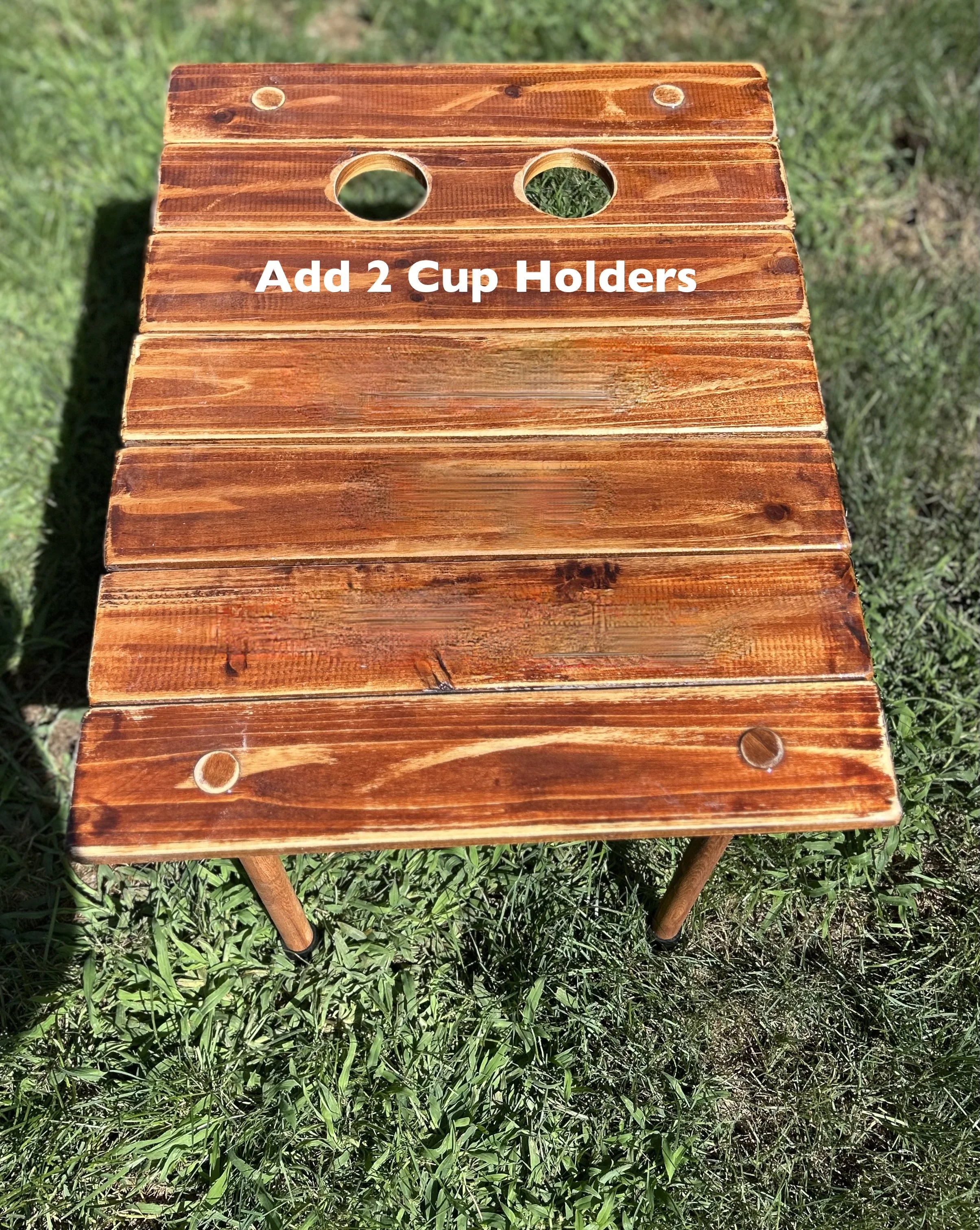 a cedar brown roll out table in a bag with a motor boat and fishing pole and the words "boat life" in a backyard displaying 2 red solo cups