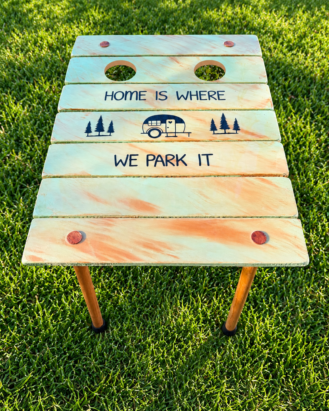 Rustic Camper Table on Sunlit Grass.png