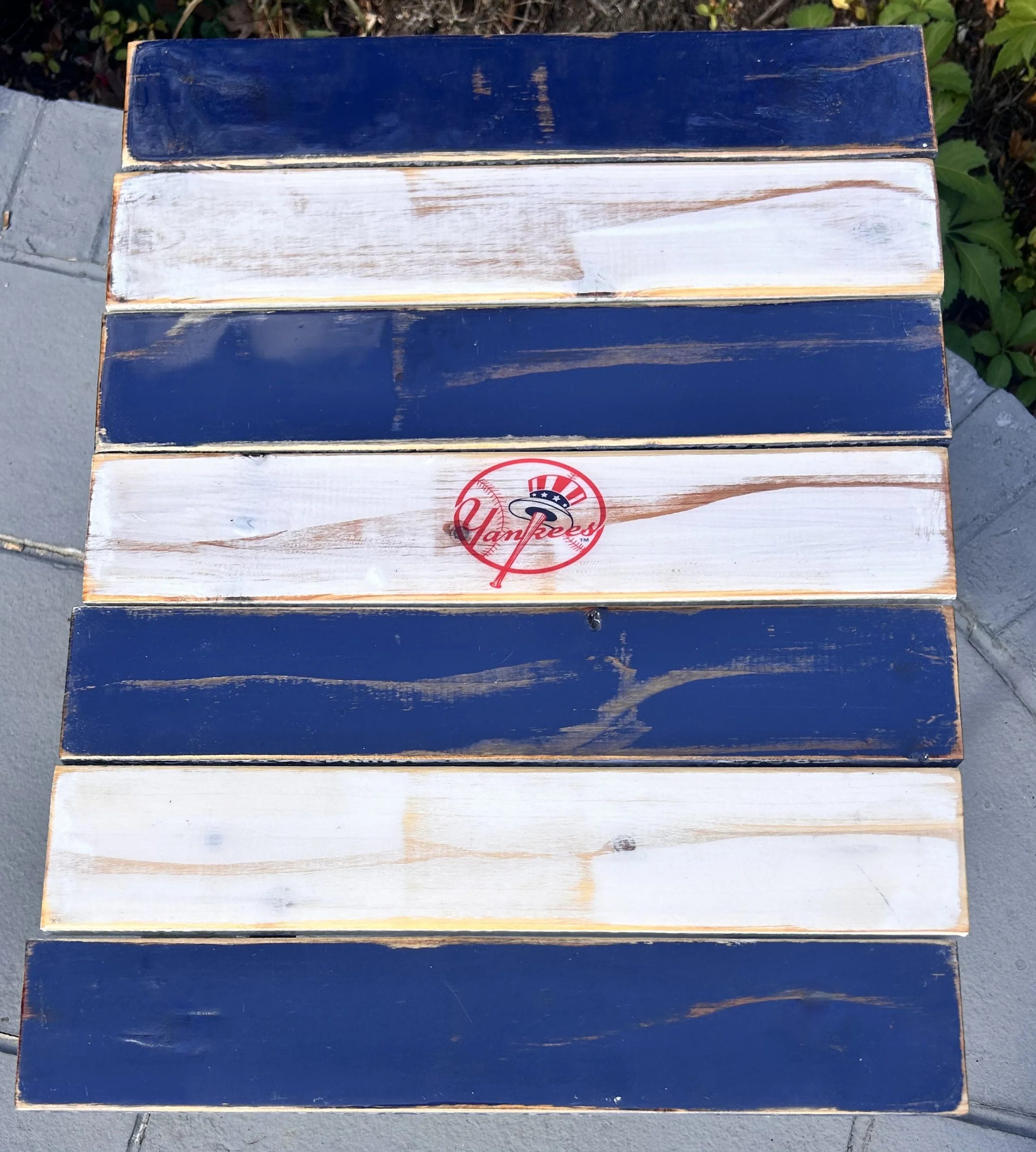 Handcrafted New York Yankees roll-out table in a bag with navy and white cedar boards, portable folding tailgate table surrounded