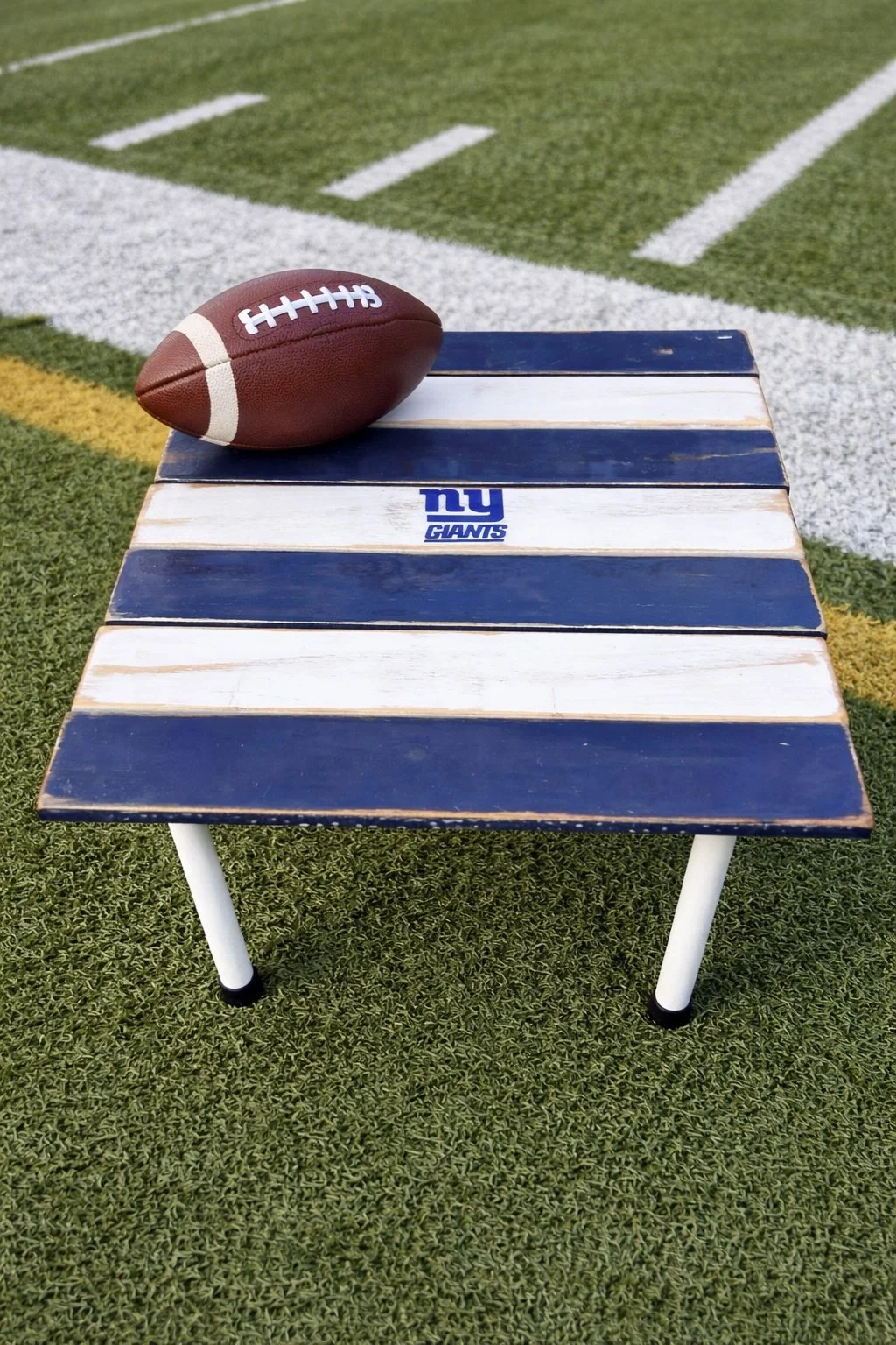 Handcrafted cedar roll-up table featuring NY Giants artwork, perfect for tailgating, camping, and game day gatherings. Lightweight, portable, and sets up in under a minute.