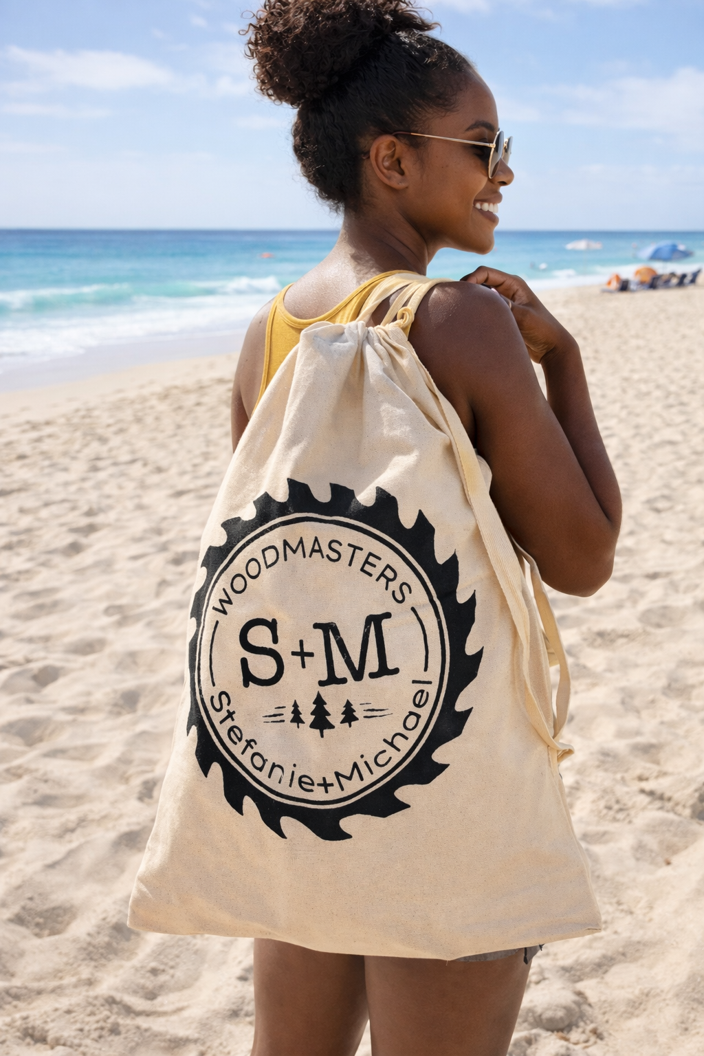 a black woman holding smwoodmasters roll out table in a bag