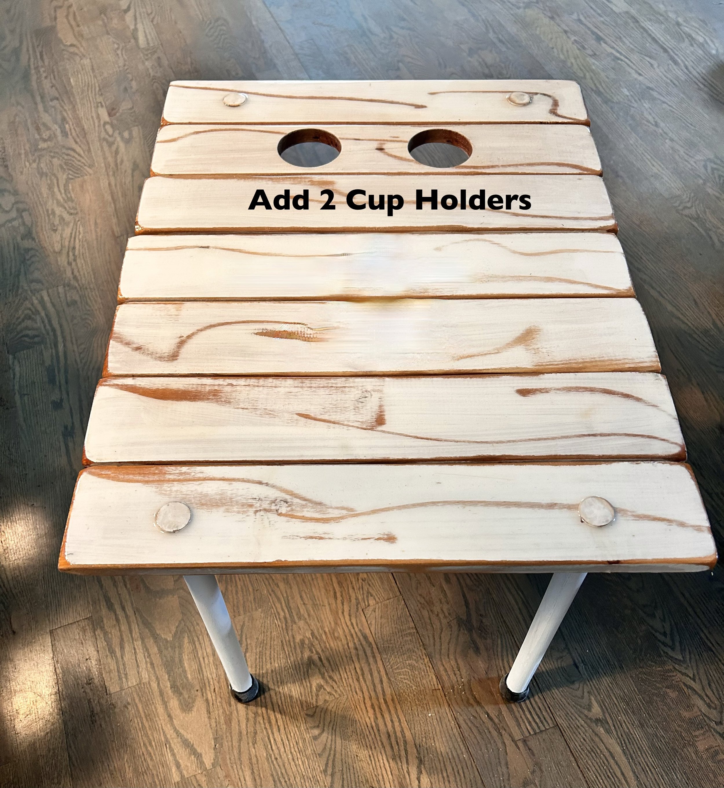 a roll out table in a bag with two holes for cup holders