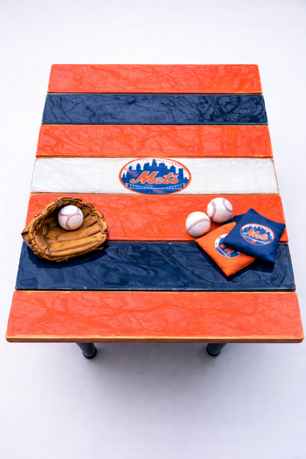 New York Mets themed roll-out cedar table on a deck with a drink, outdoor folding table for tailgating and patio use