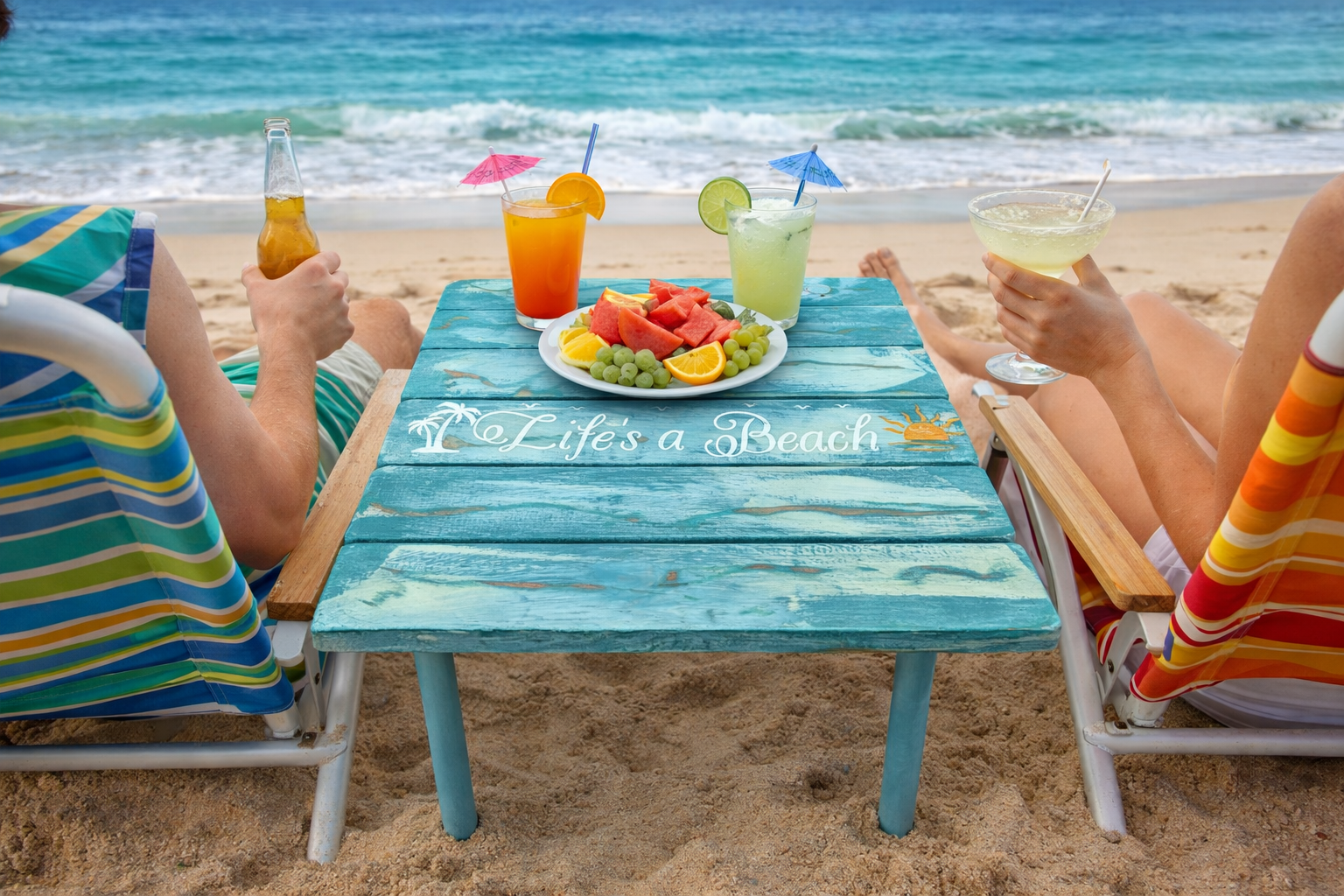 life's a beach turquoise portable beach table in a bag on the beach