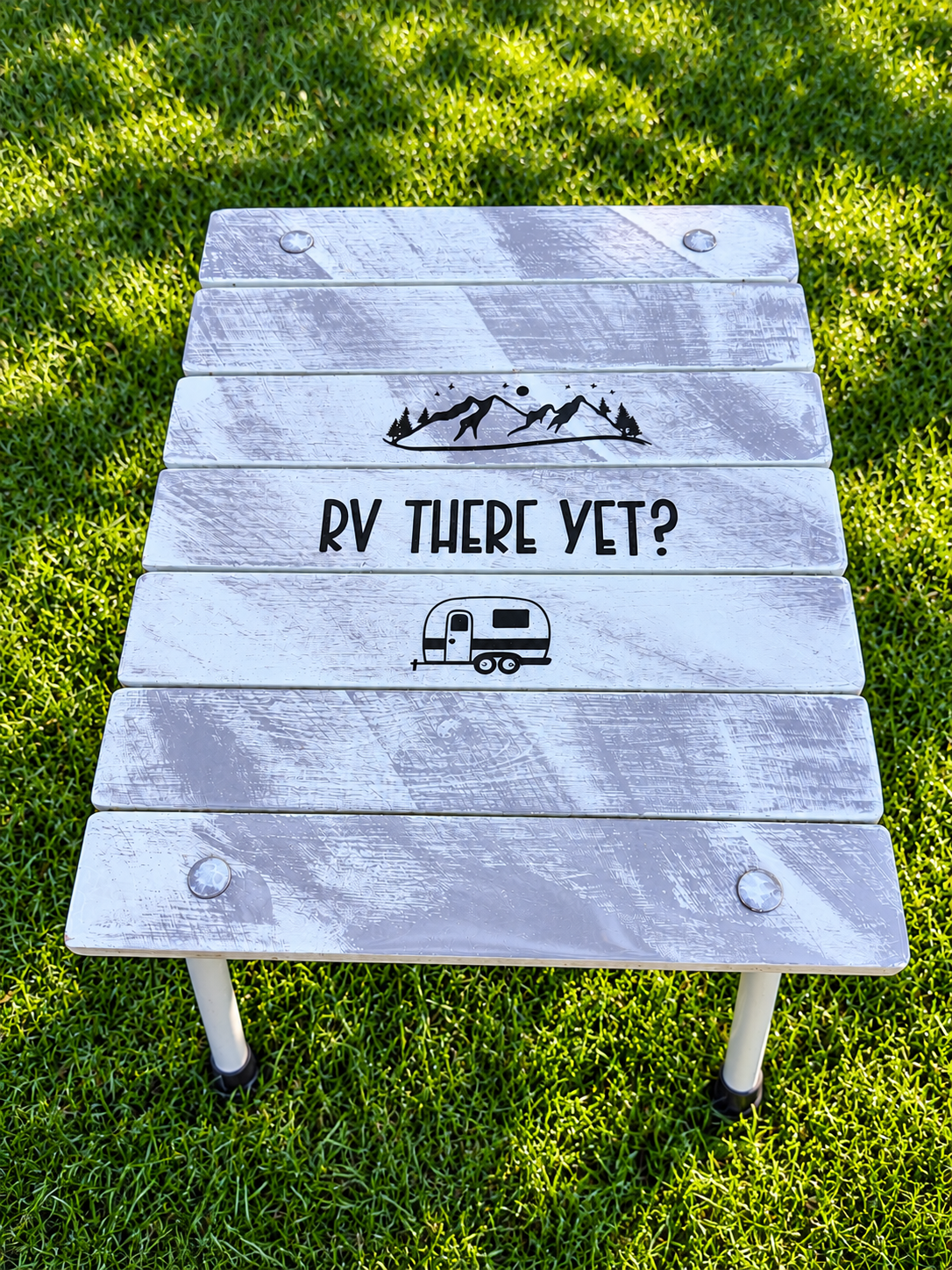Rustic RV Camping Table on Green Grass.png