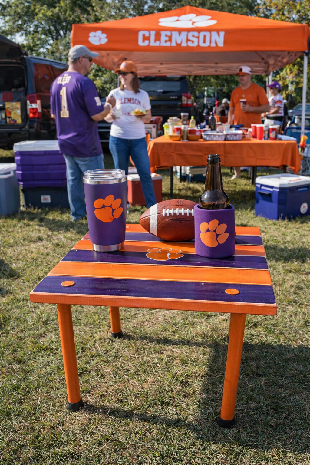 Clemson roll-out table at a tailgating setup, orange and purple portable cedar table with Clemson paw logo used for game day drinks and snacks