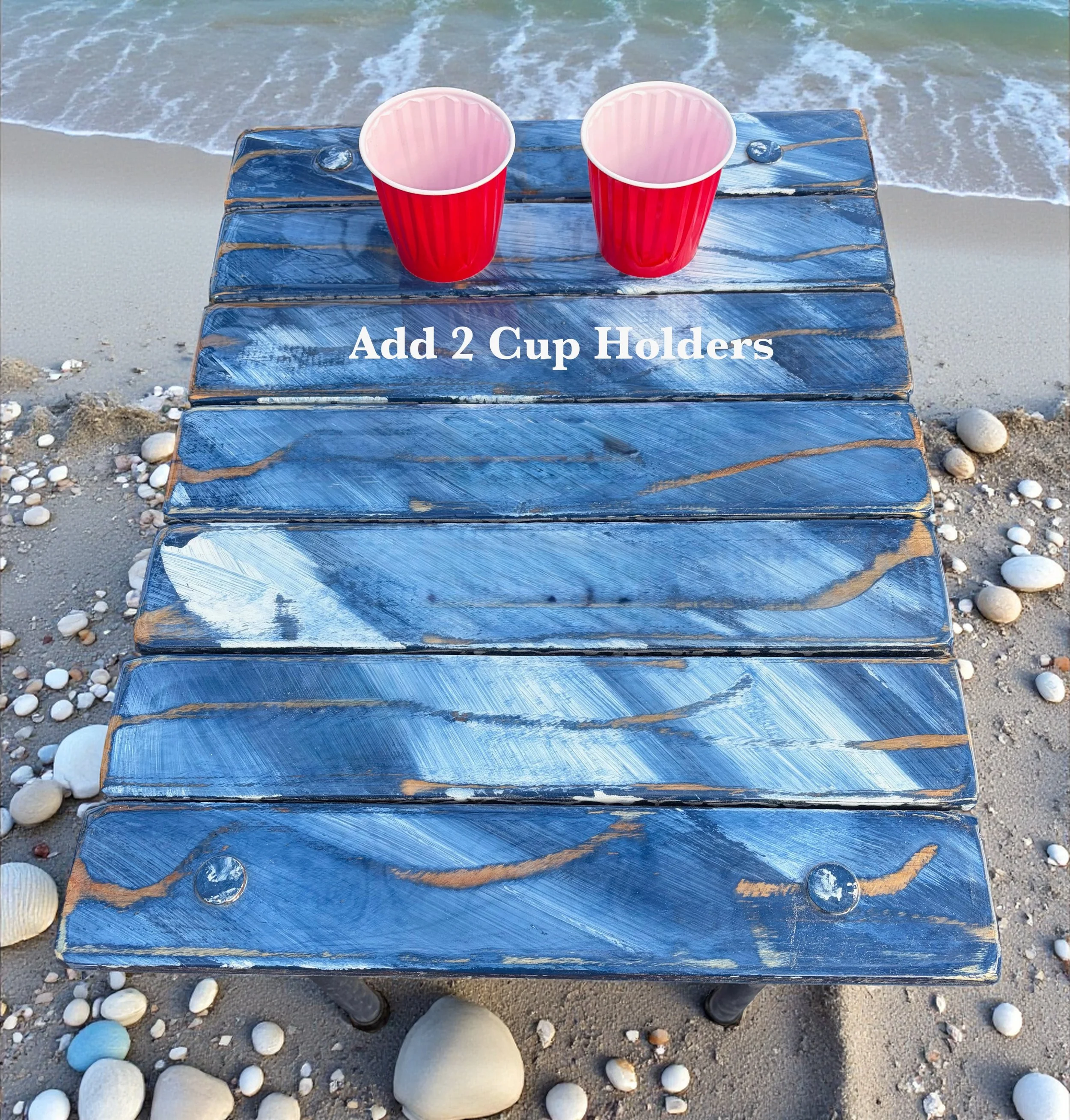 blue table with cup holders with 2 red solo cups, for the roll out table in a bag
