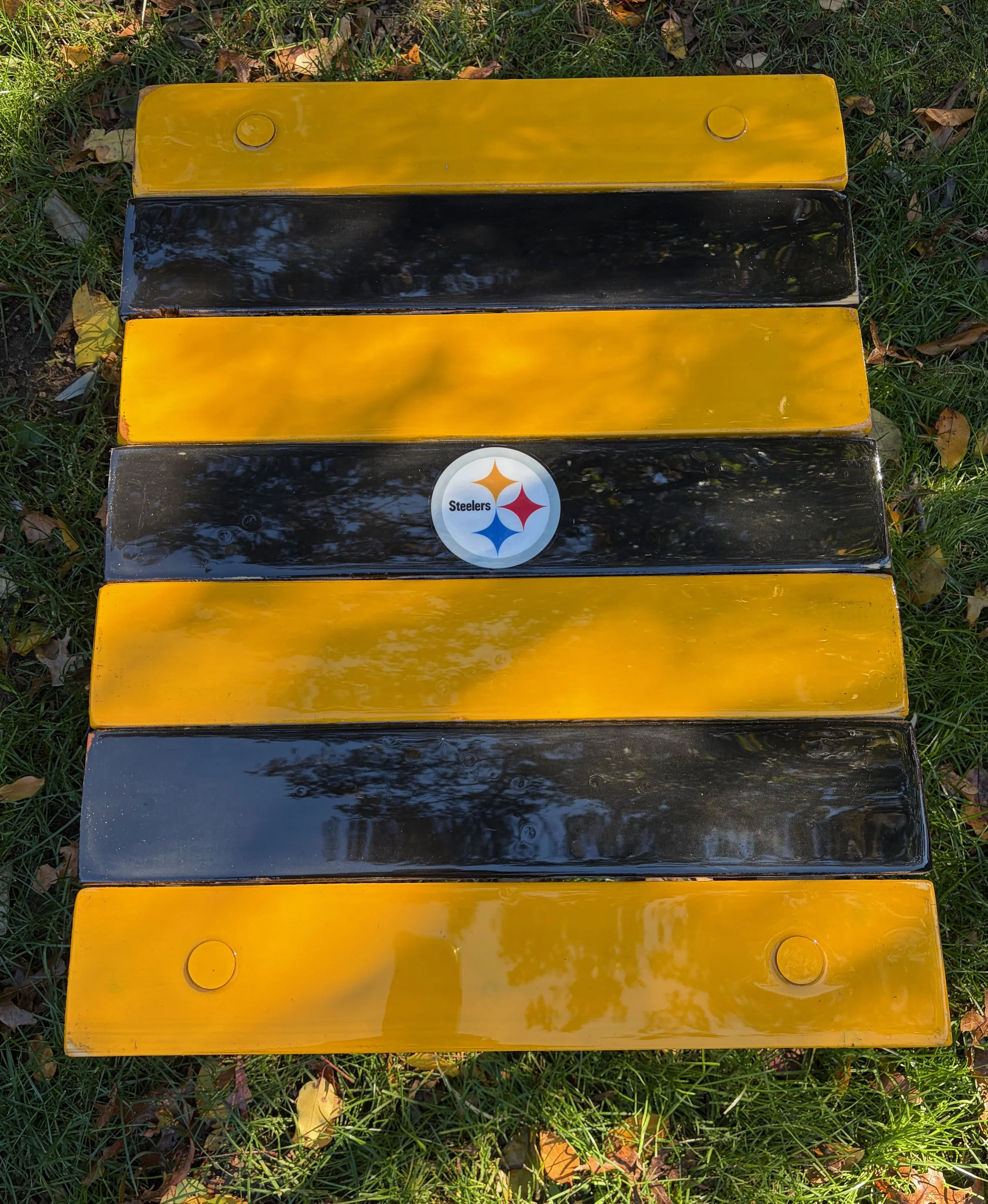 Pittsburgh Steelers black and gold roll-out table in a bag on grass, handcrafted cedar portable table by S & M Woodmasters