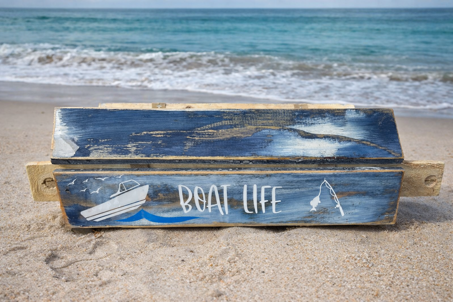 denim blue cedar roll out table on the beach shown rolled up