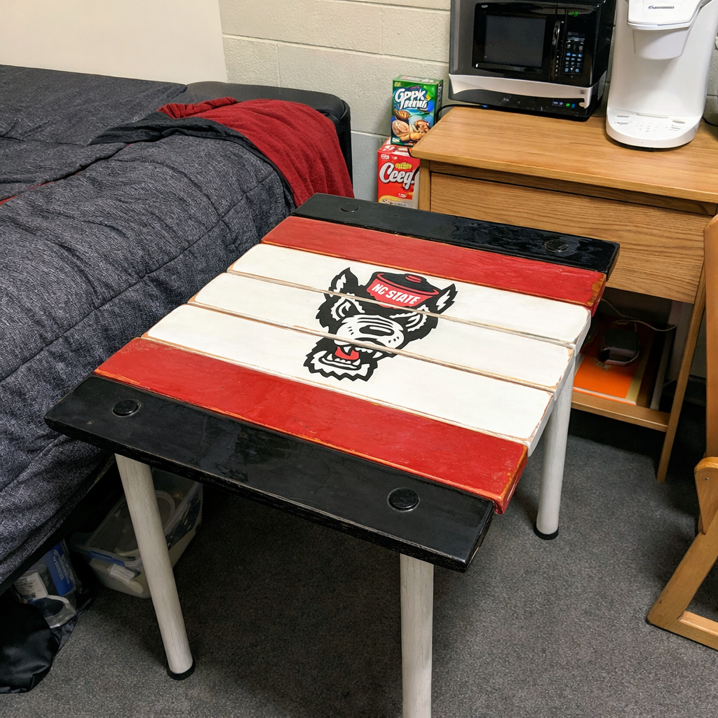 Handcrafted NC State Wolfpack roll-out table made from solid cedar wood. Lightweight, portable, and perfect for dorm rooms, apartments, and game days.