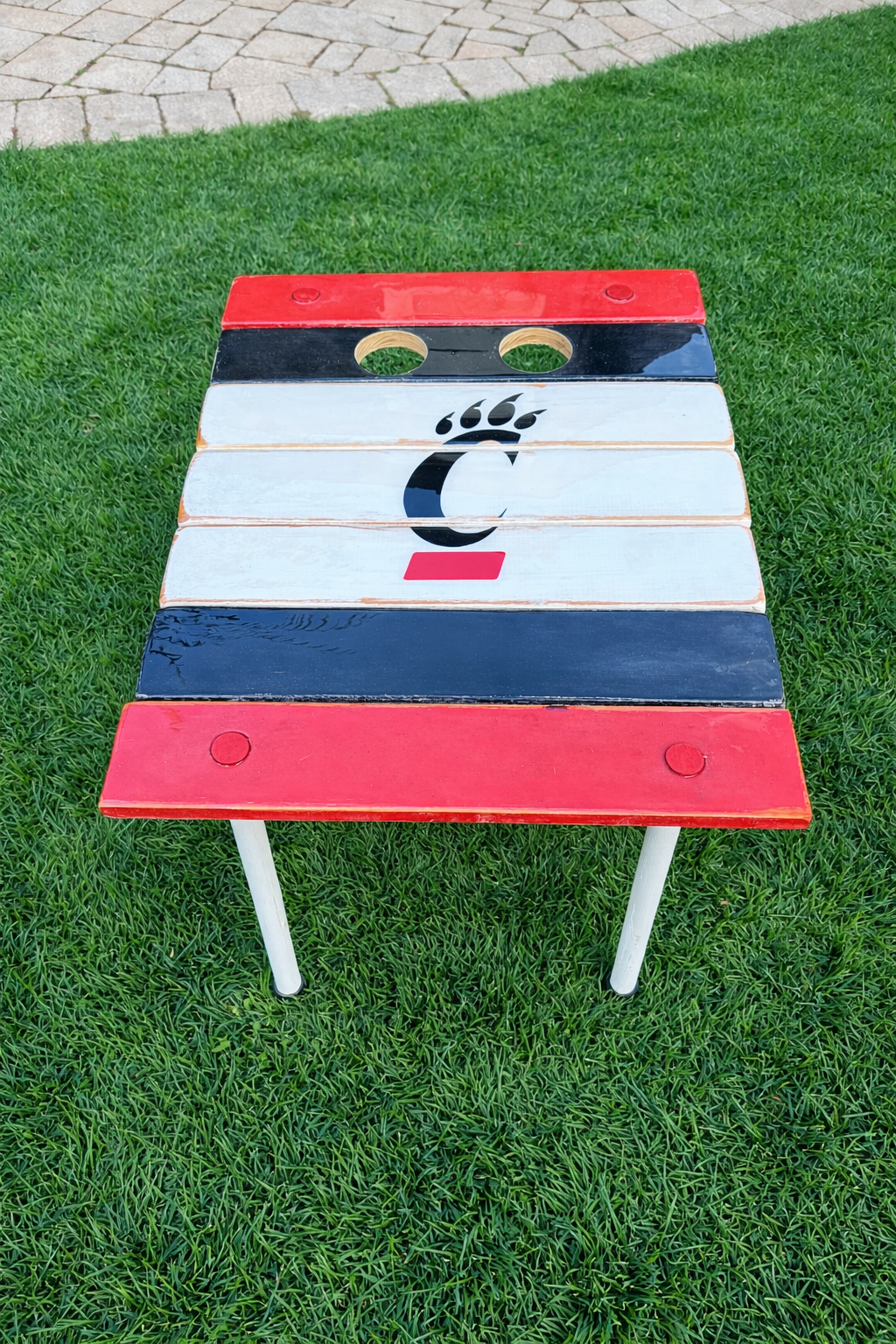 university-of-cincinnati-roll-out-table-on-green-grass.png