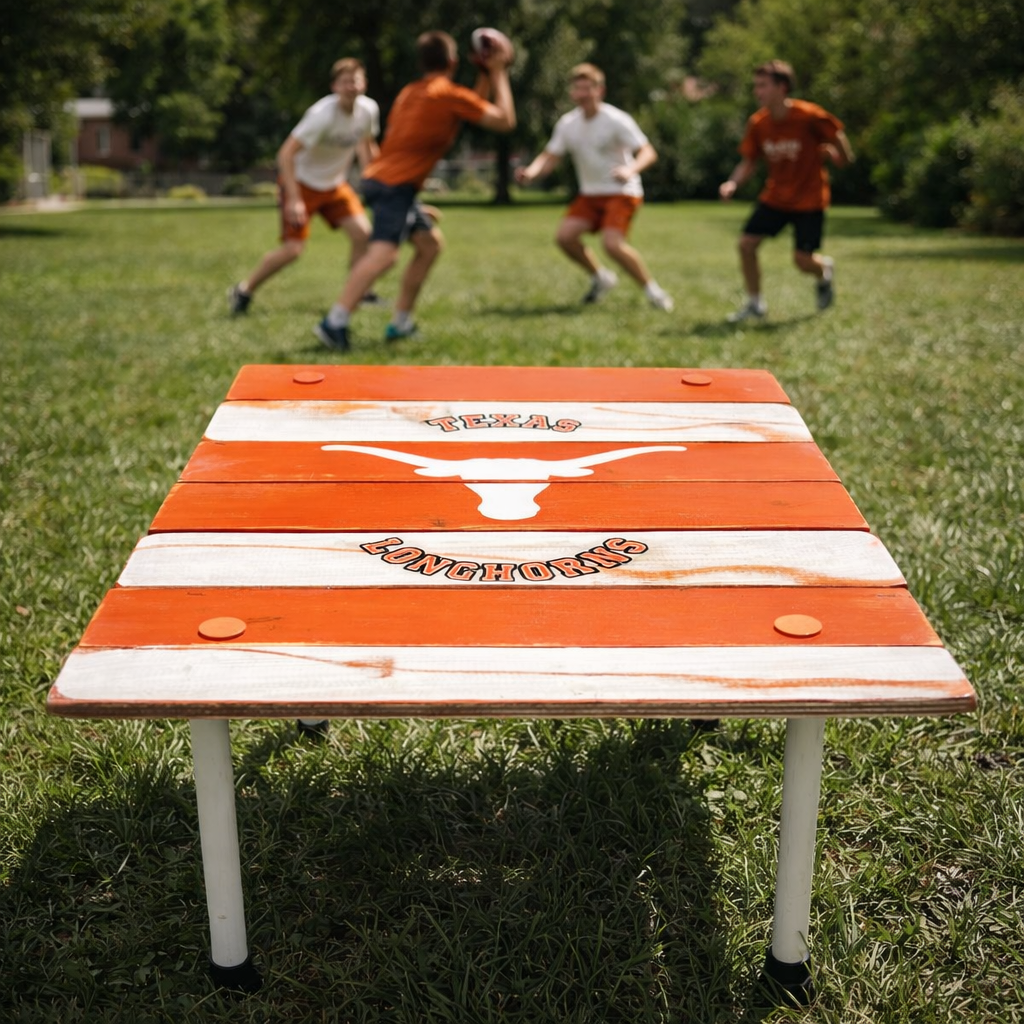 University of Texas Longhorns roll-out table outdoors with students playing football in the background, handcrafted cedar wood portable table for game days