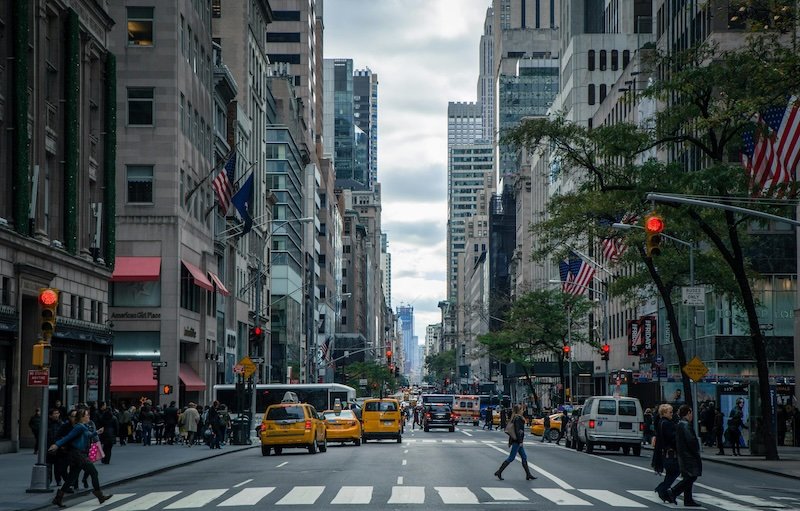 Manhattan street scene with yellow taxis representing Hudson Yards Clean house cleaning service areas in NYC