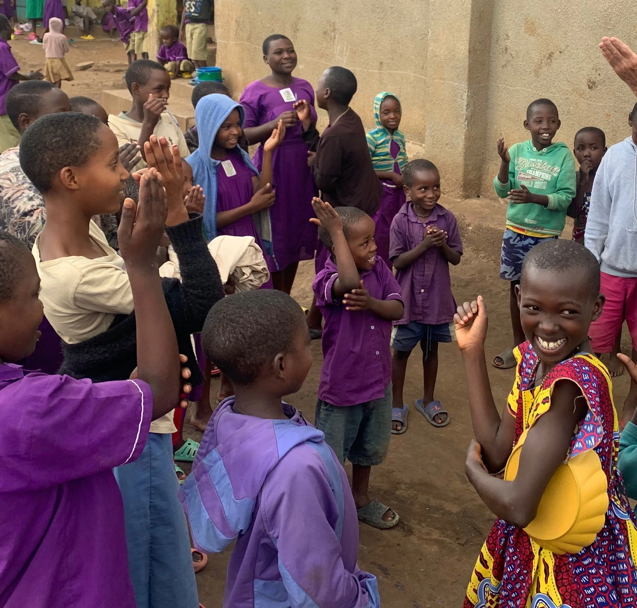 Deaf children at the Kajaho Refugee school signing “Good afternoon” when our team arrived.