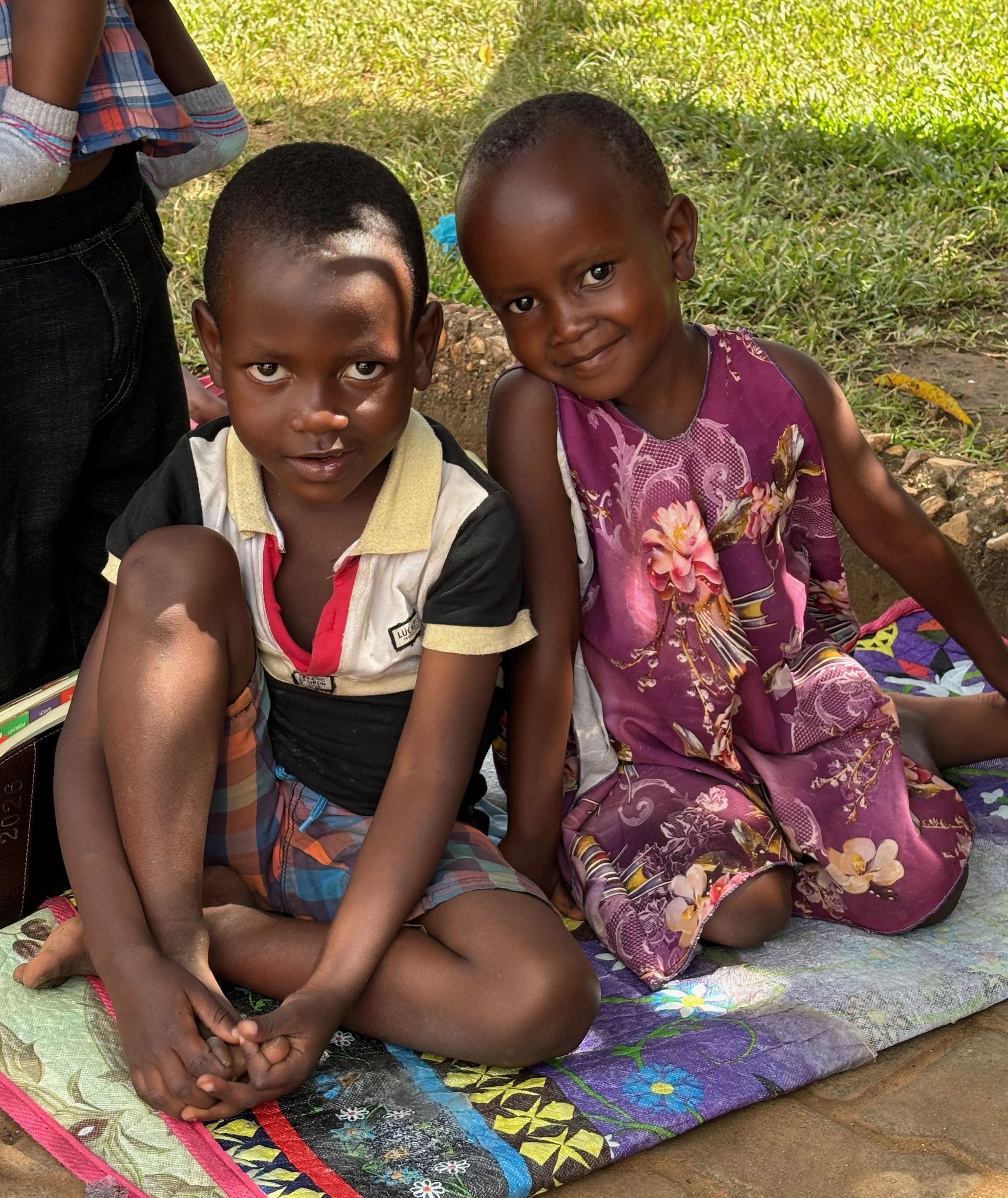 Two small children rescued by team member Francis.