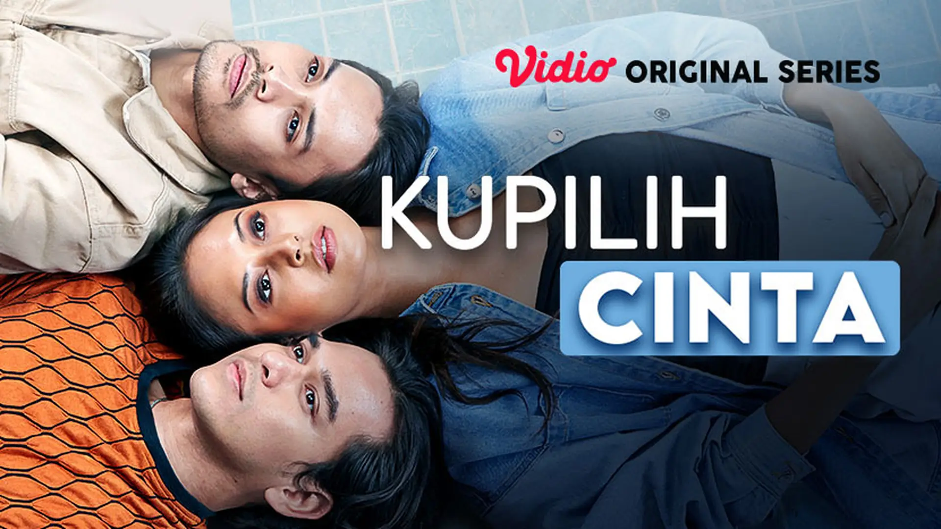 Three people lying on the floor, with the title 'Kupilih Cinta' and the words 'Vidio Original Series' displayed over the image, suggesting it is a promotional poster for a series.