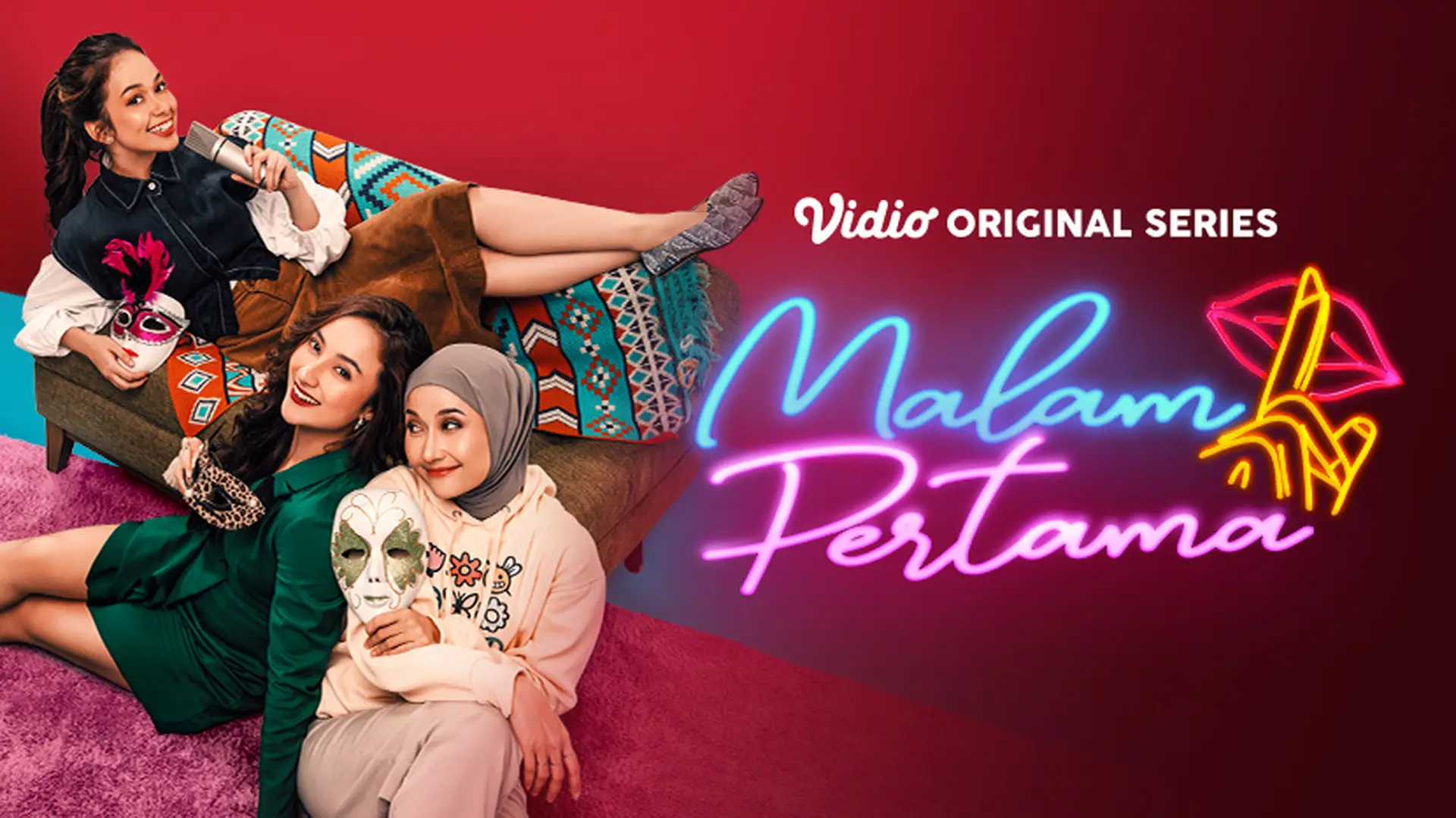 Three women lying on a colorful couch and carpet, holding costume props, with neon-style text and graphics promoting the Vidio original series 'Nalam Pertama'.