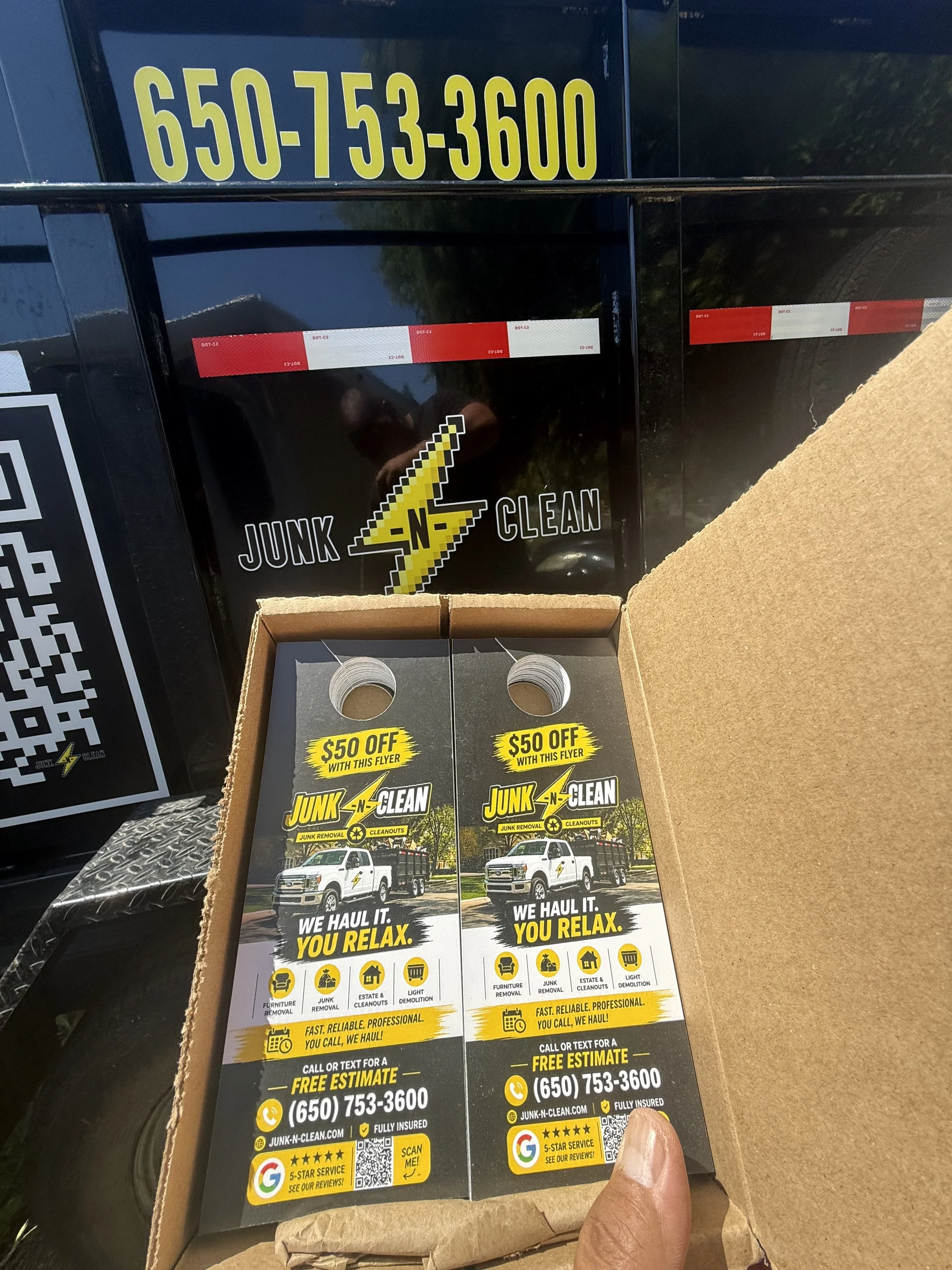 Flyers for Junk-N-Clean, a junk removal service, offering $50 off with the flyer, featuring a truck and listing services like furniture removal, junk removal, estate and cleanouts, light demolition, and a phone number for contact.