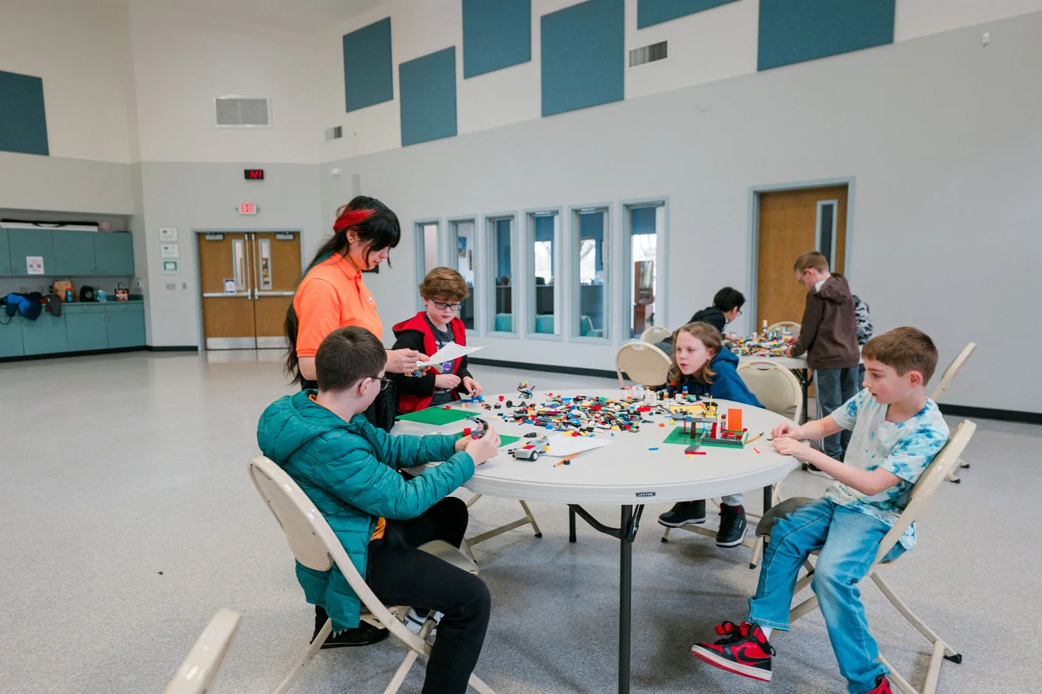 An instructor guiding a small group at a table