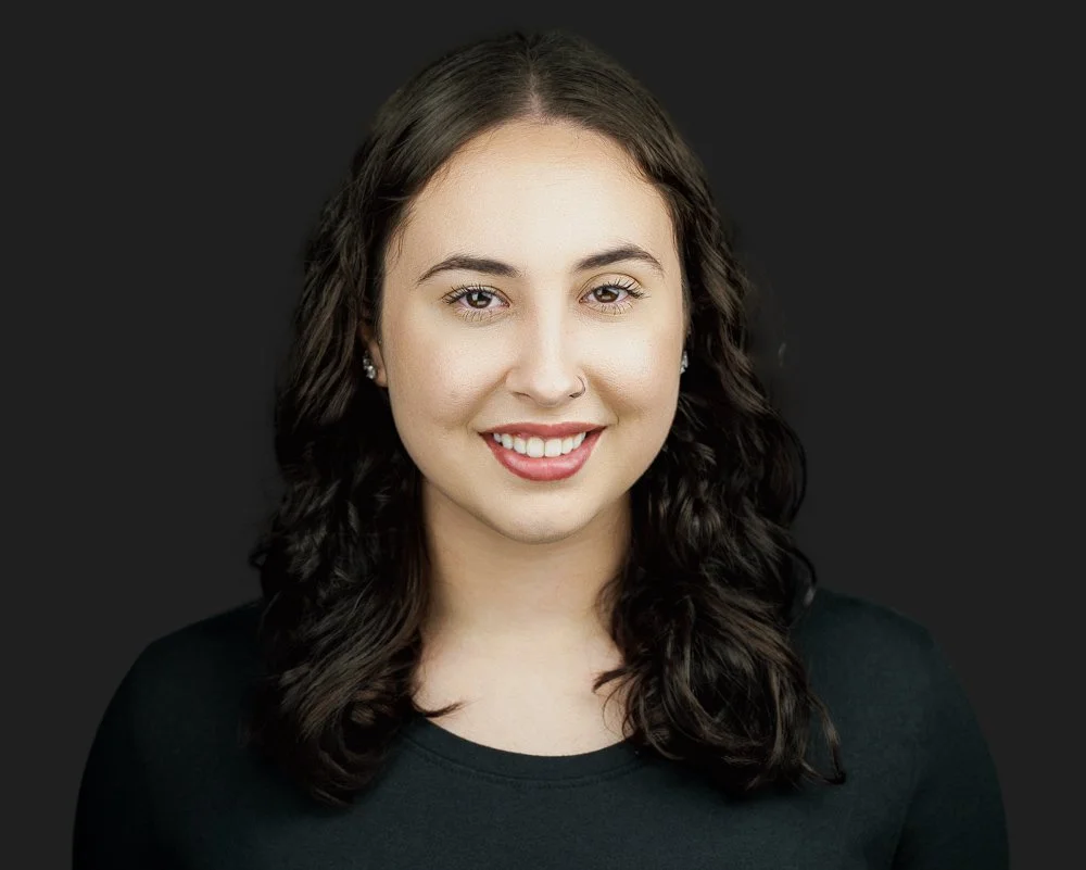 Professional headshot of a young business professional, clean background, Manchester Connecticut