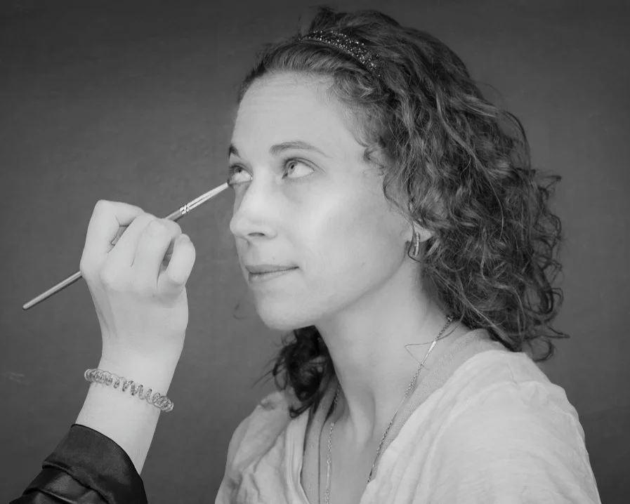 Rick Morgan Photography Manchester CT. Black and white photo of a woman receiving eye makeup with a brush