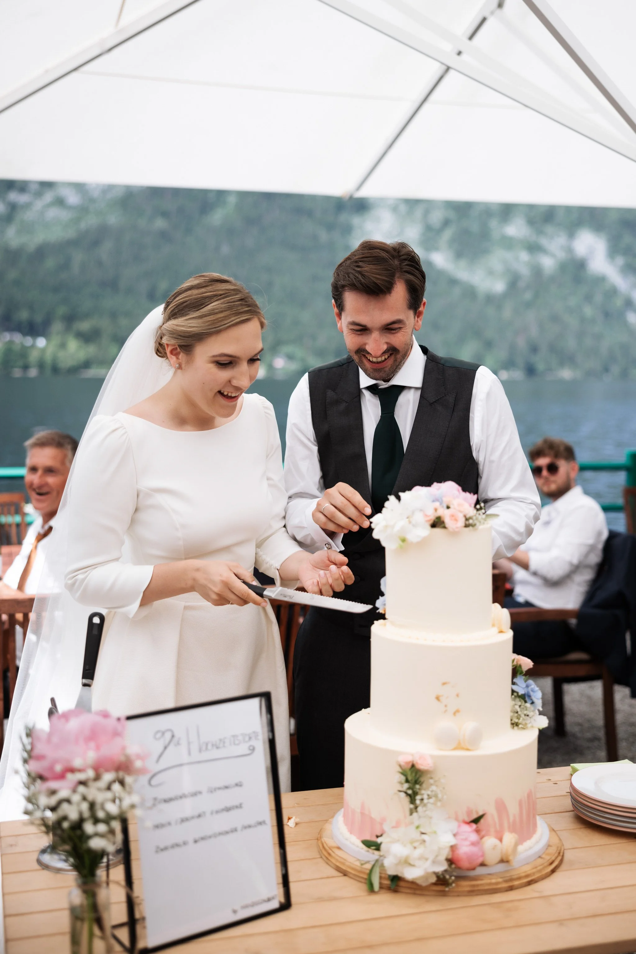 Wedding photographer Austria — bride and groom at Strandcafé Altaussee