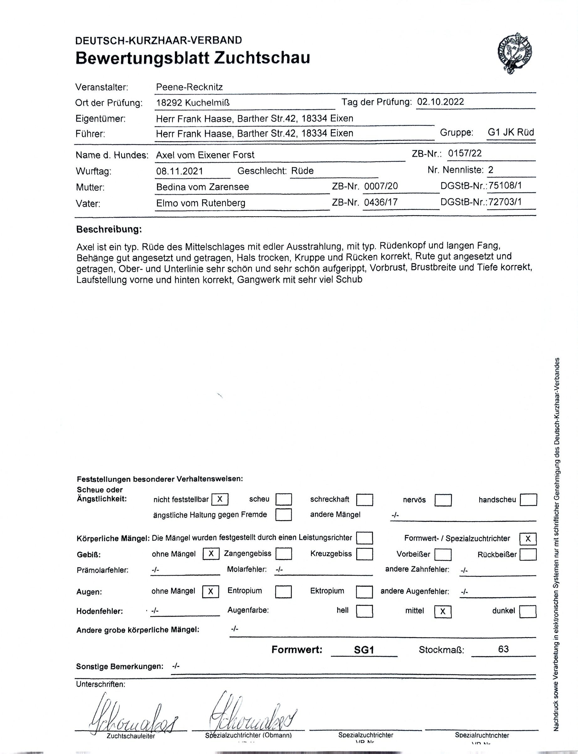 A German dog breeding evaluation sheet filled out with handwritten signatures at the bottom.