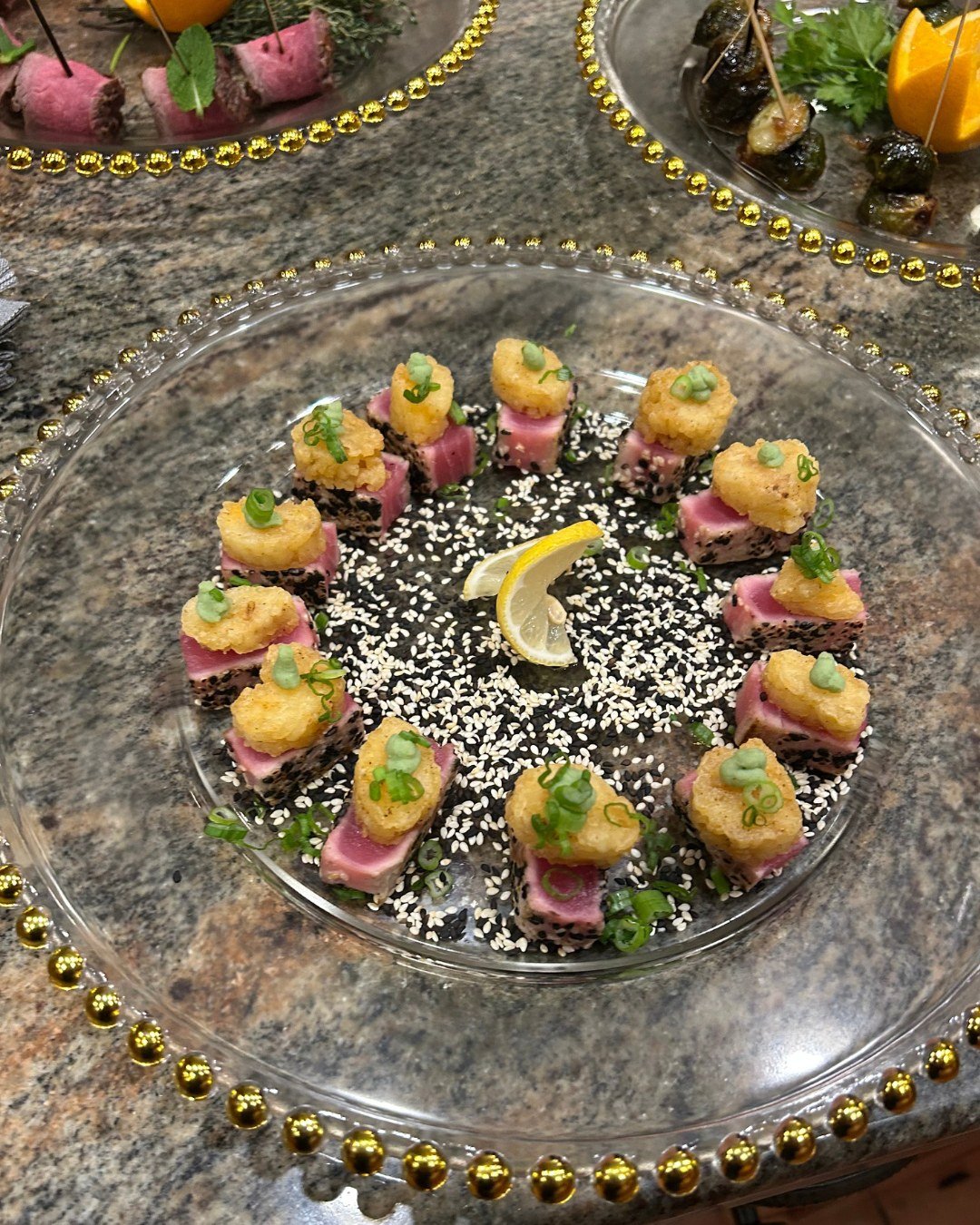 Before guests took their seats for the plated dinner, we set the tone with bold bites and elegant presentation. From sesame-seared ahi tuna on crispy rice to Brussels sprout &ldquo;lollipops&rdquo; and bone-free lamb skewers, these hors d'oeuvres wer