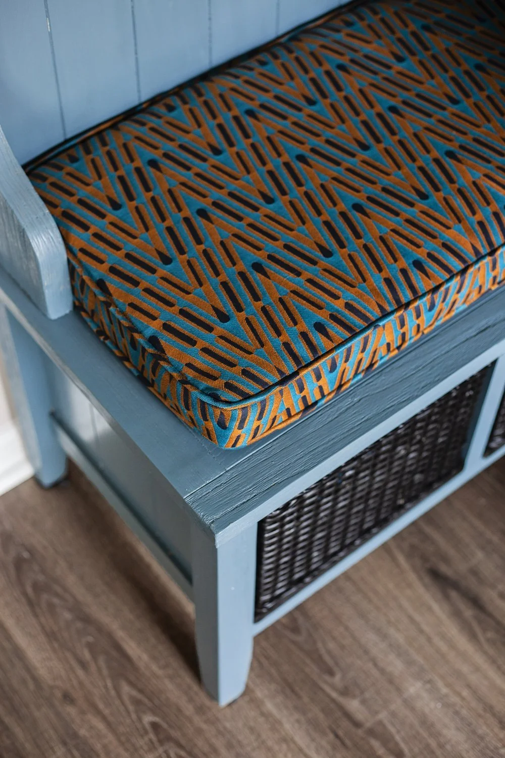 Relaxed yet refined entryway furniture featuring custom textiles and intentional styling by Marlaya Ross of Studio One Nine Interior Design.