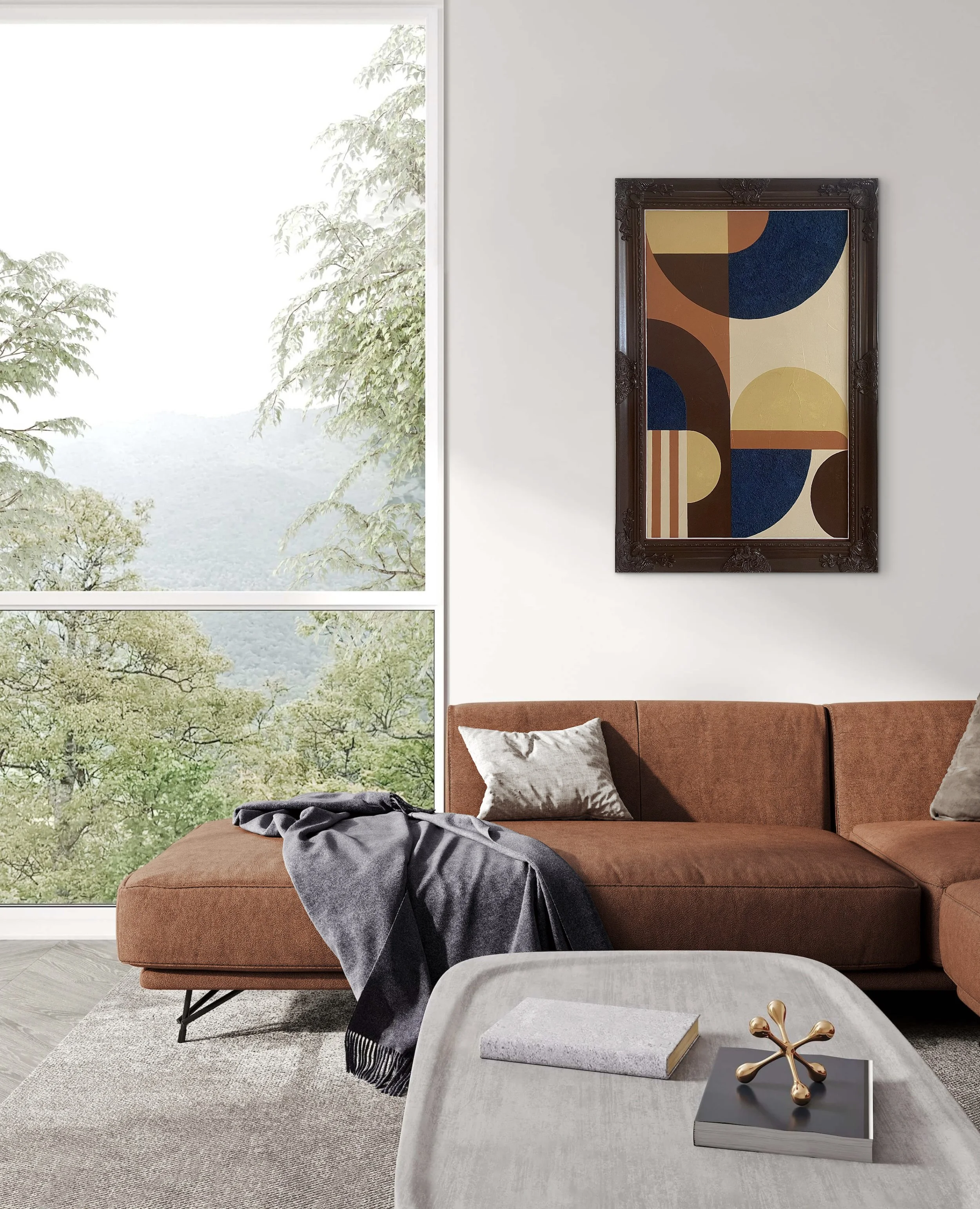 Modern living room with a brown sofa, beige pillows, a gray throw blanket, a white coffee table with a book and decorative object, and a framed abstract art piece on the wall. Large window with trees outside, letting in natural light.