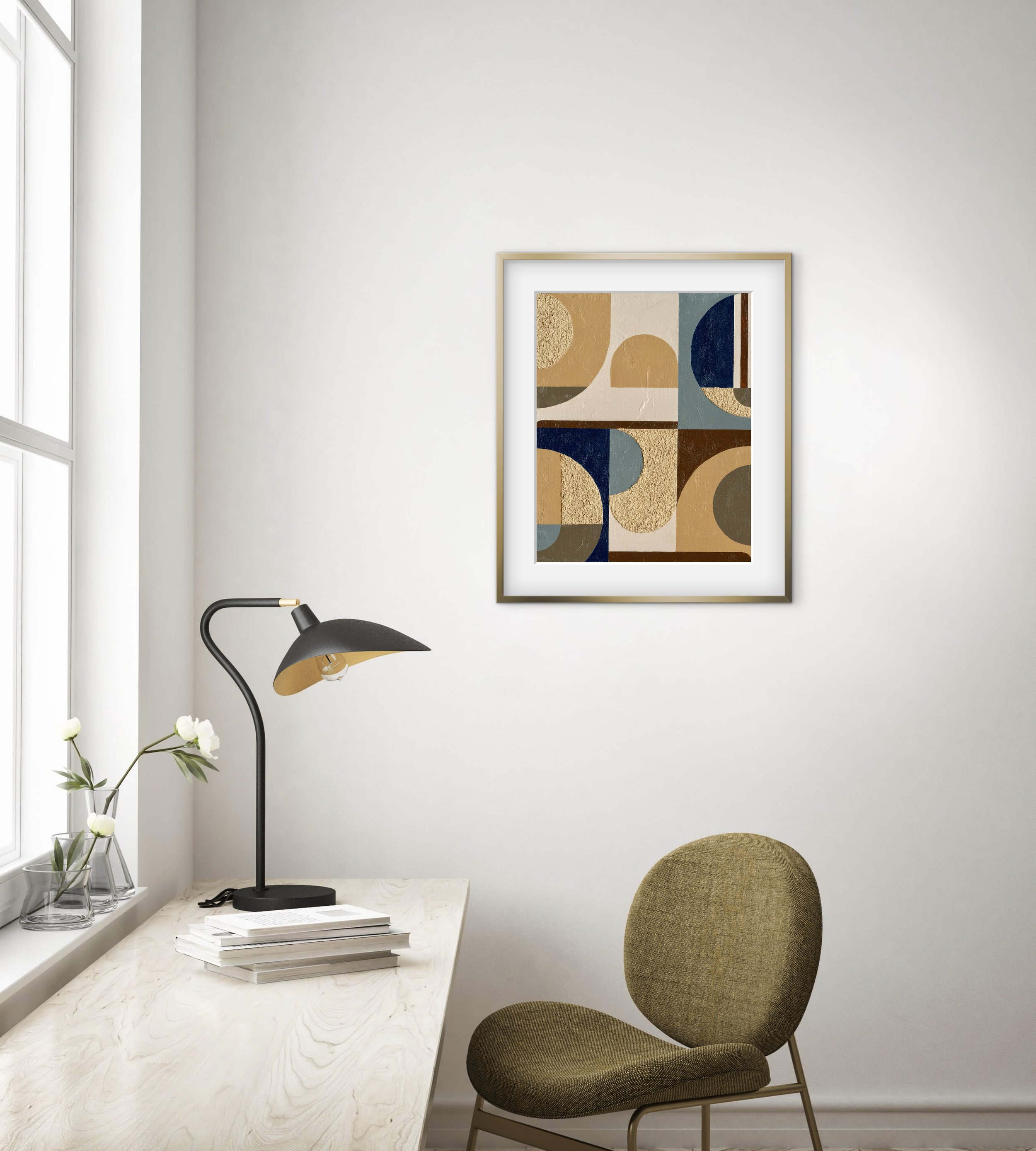 A modern, minimalistic home office with a white marble desk, a black desk lamp, a beige upholstered chair, and art on the wall featuring geometric shapes in earthy tones. There are three glass vases with white flowers on the window sill, and a window with white framing allowing natural light.
