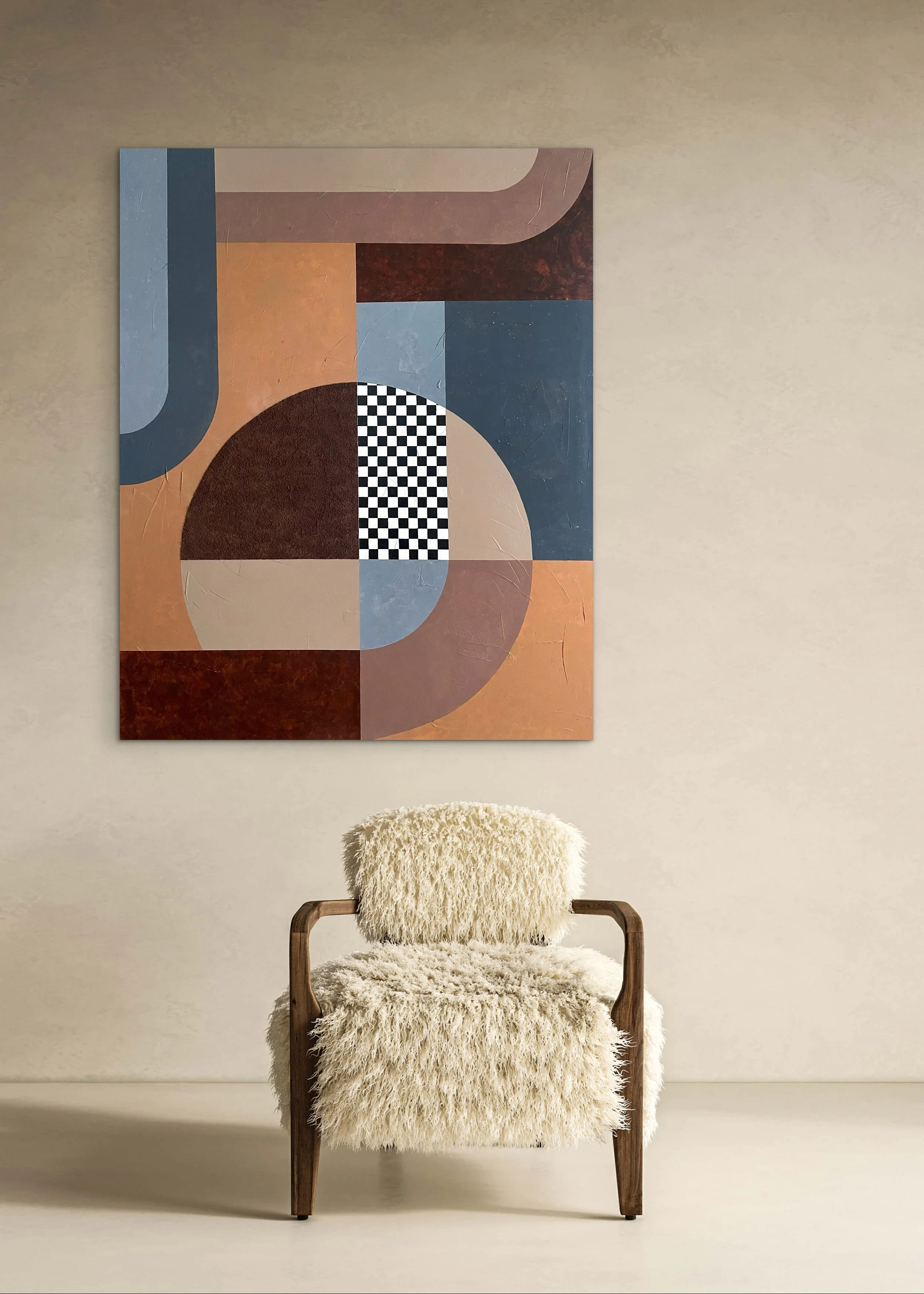 A wooden chair with a fluffy cream-colored cushion and backrest, positioned in front of a beige wall with a colorful abstract painting.
