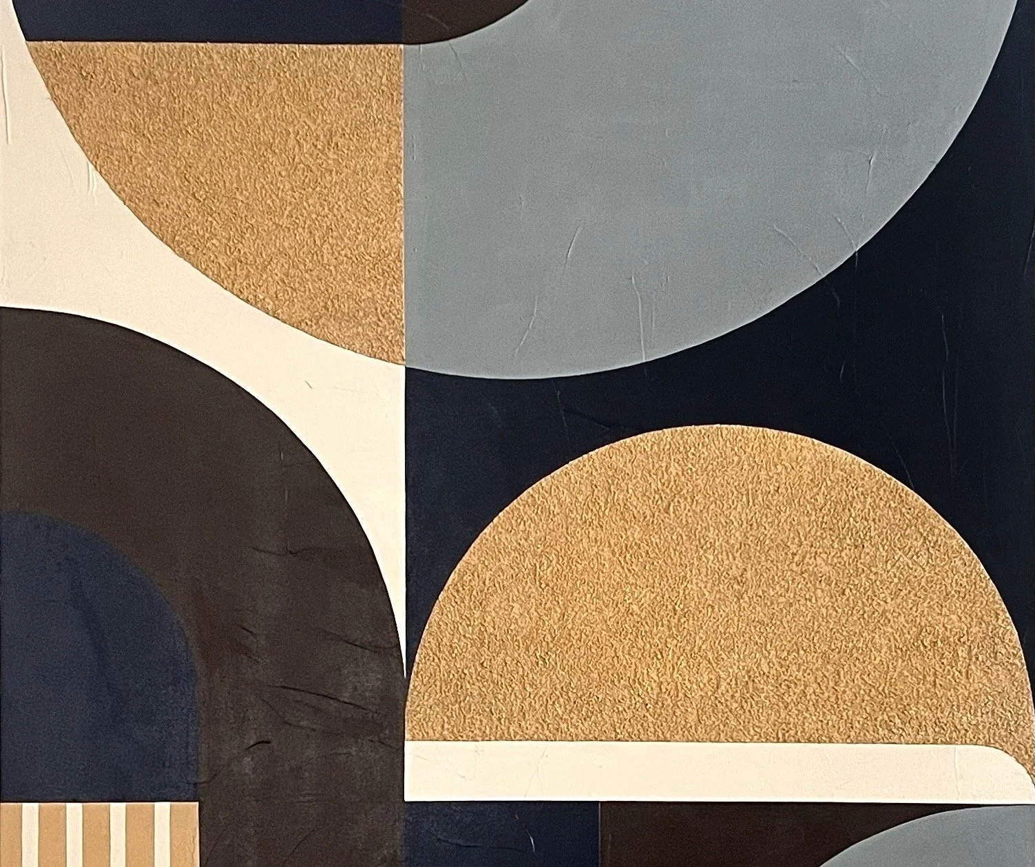 A geometric abstract artwork featuring overlapping semi-circular and rectangular shapes in shades of black, white, gray, navy, and gold with textured and smooth finishes.
