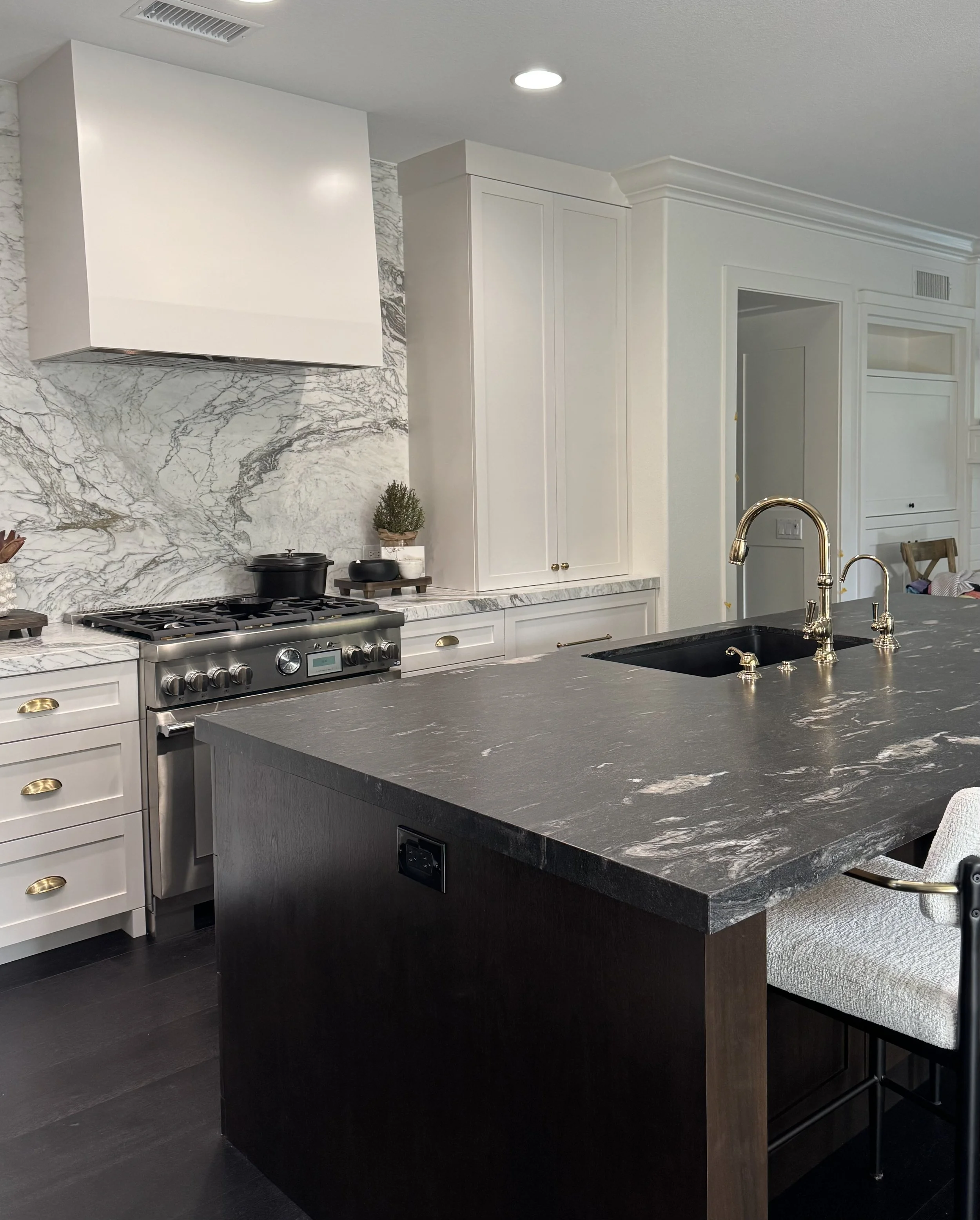 Timeless Kitchen Design with marble counter and backsplash, high end appliances, custom designed hood, walnut island with black granite island top.