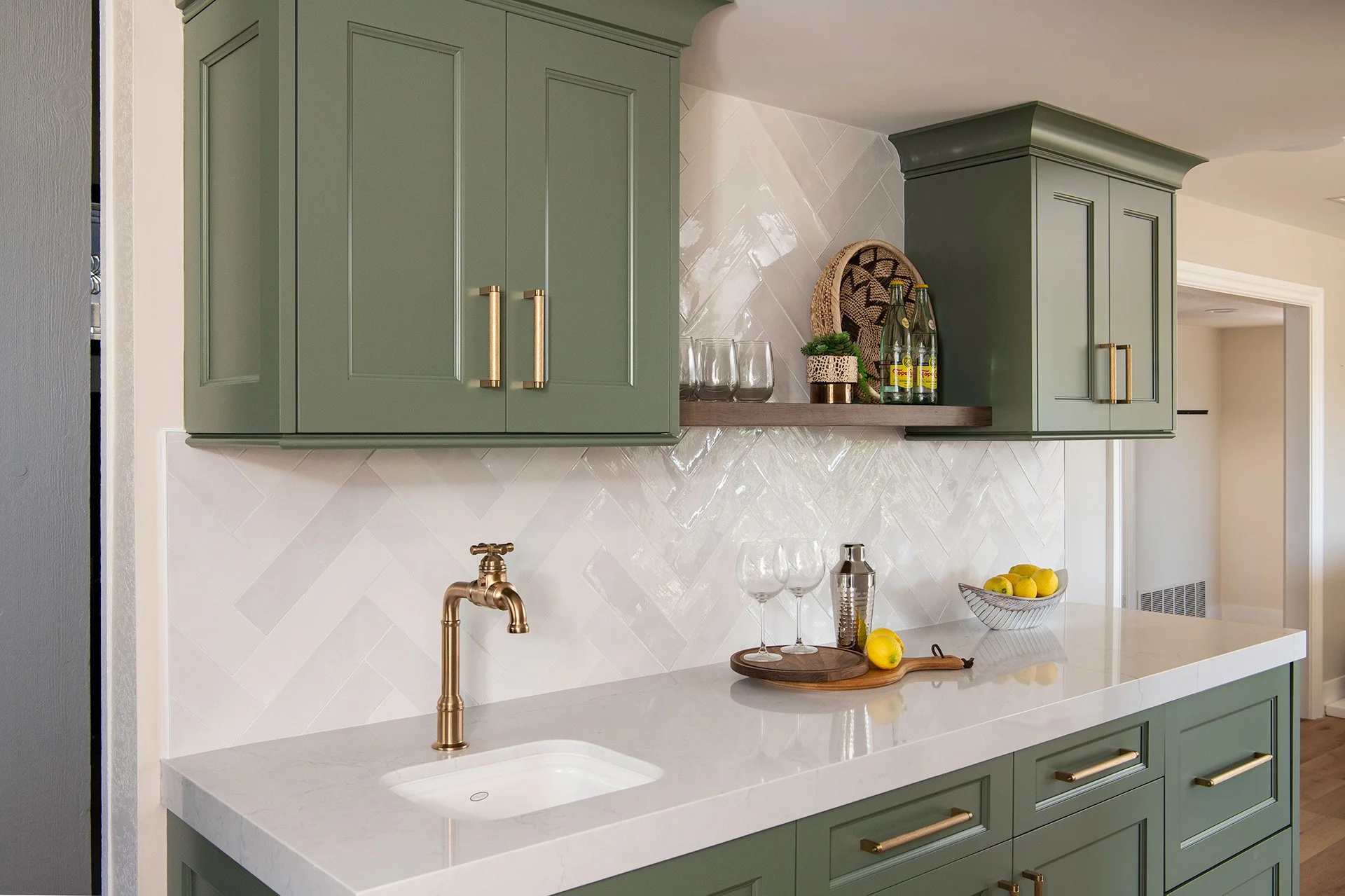 Playful Plumbing & Sage Green Cabinets
