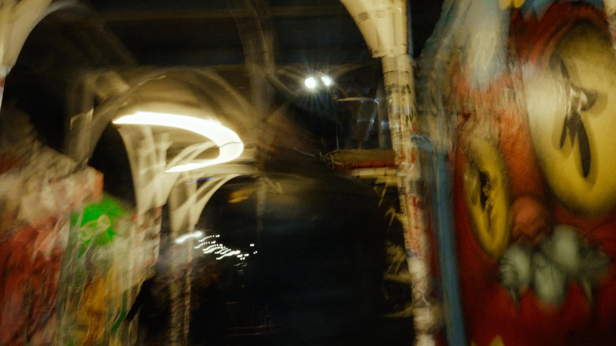 Blurred graffiti and lights in a tunnel