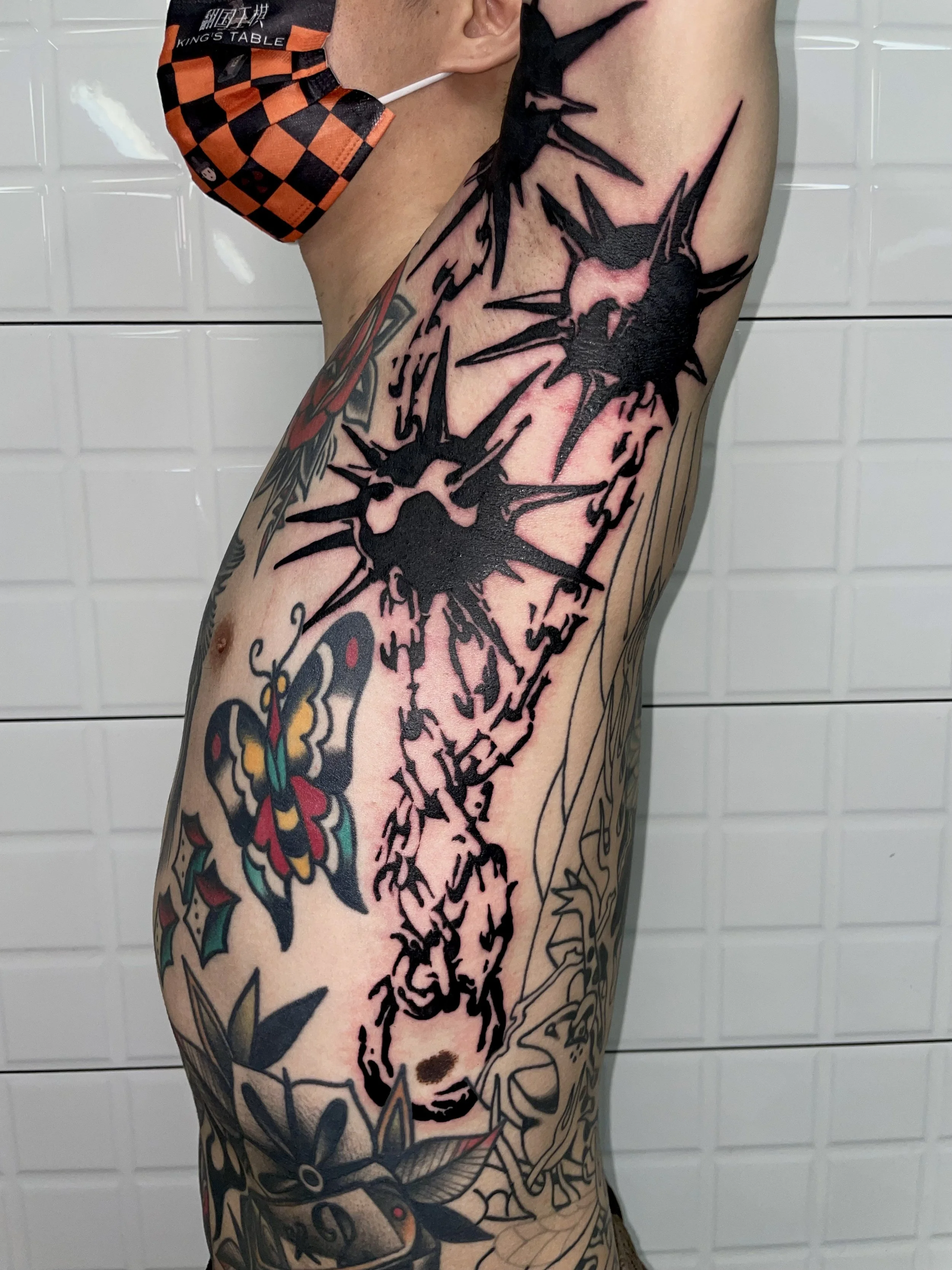 CAIN immaculate scar style Brooklyn NYC tattoo artist blackwork ribs armpits meteor hammer weapons tattoo