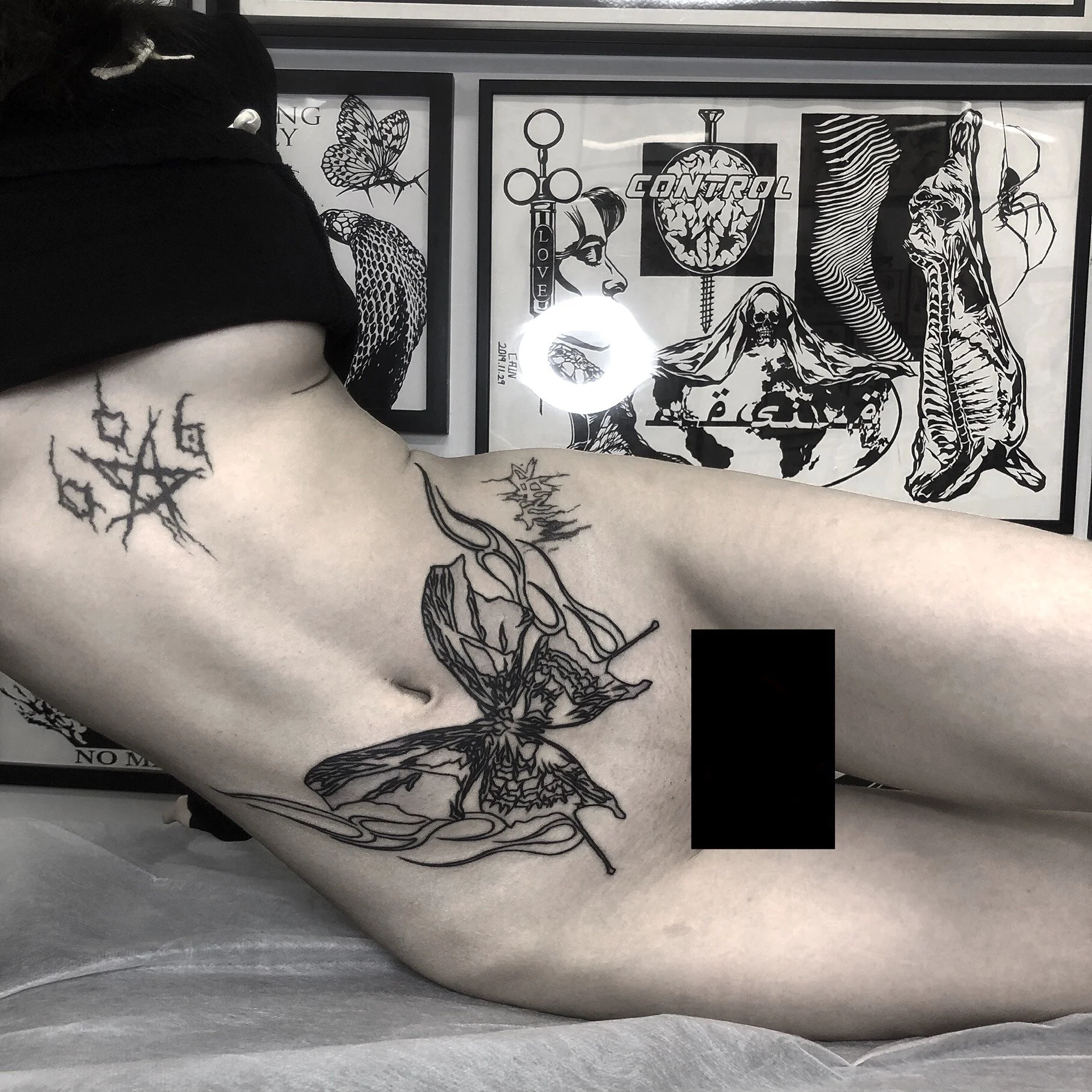 Brooklyn NYC black art totem butterfly tattoo/lower abdomen tattoo for girls