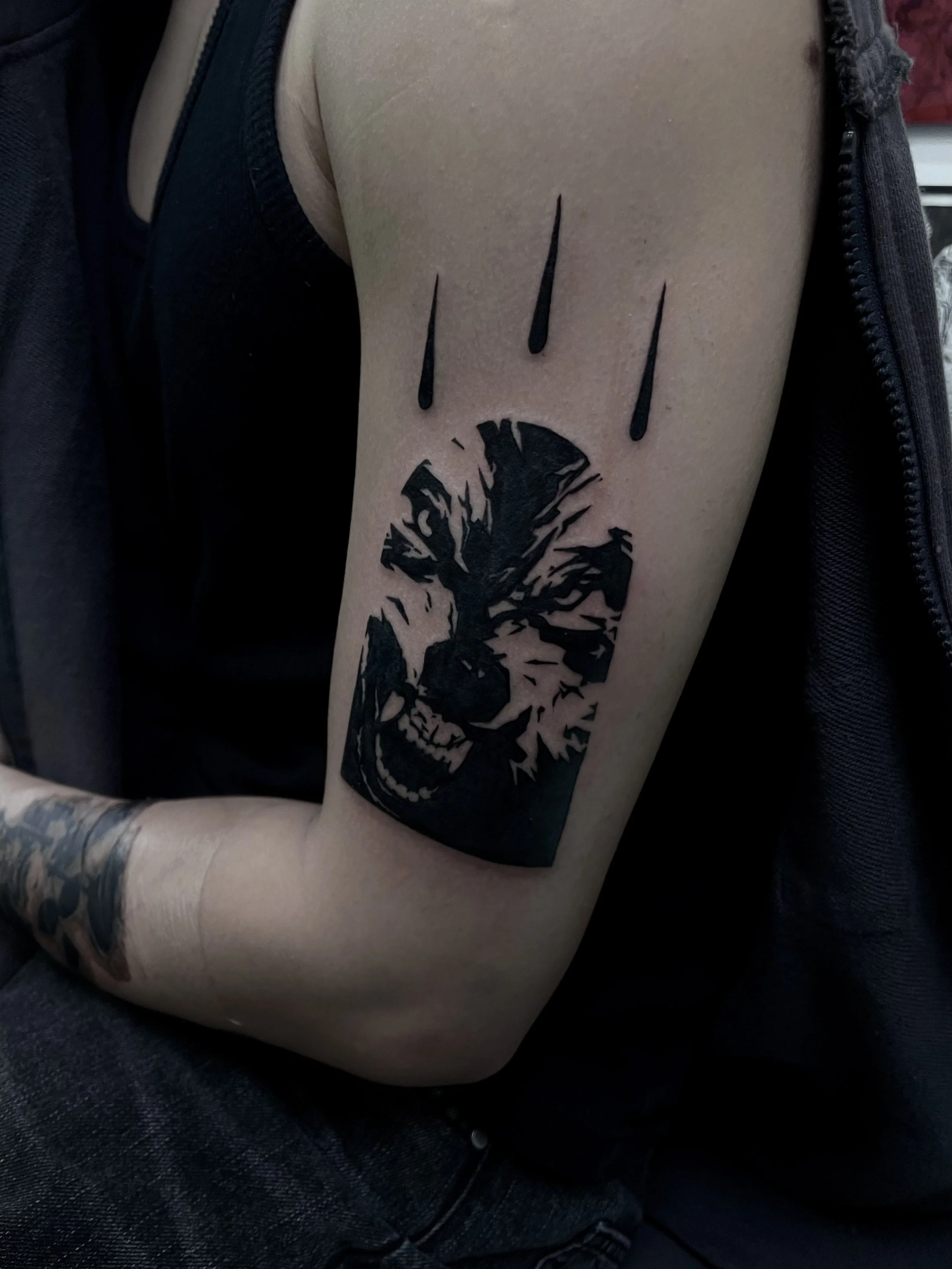 CAIN immaculate scar style Brooklyn NYC tattoo artist blackwork upper arm wolf tattoo